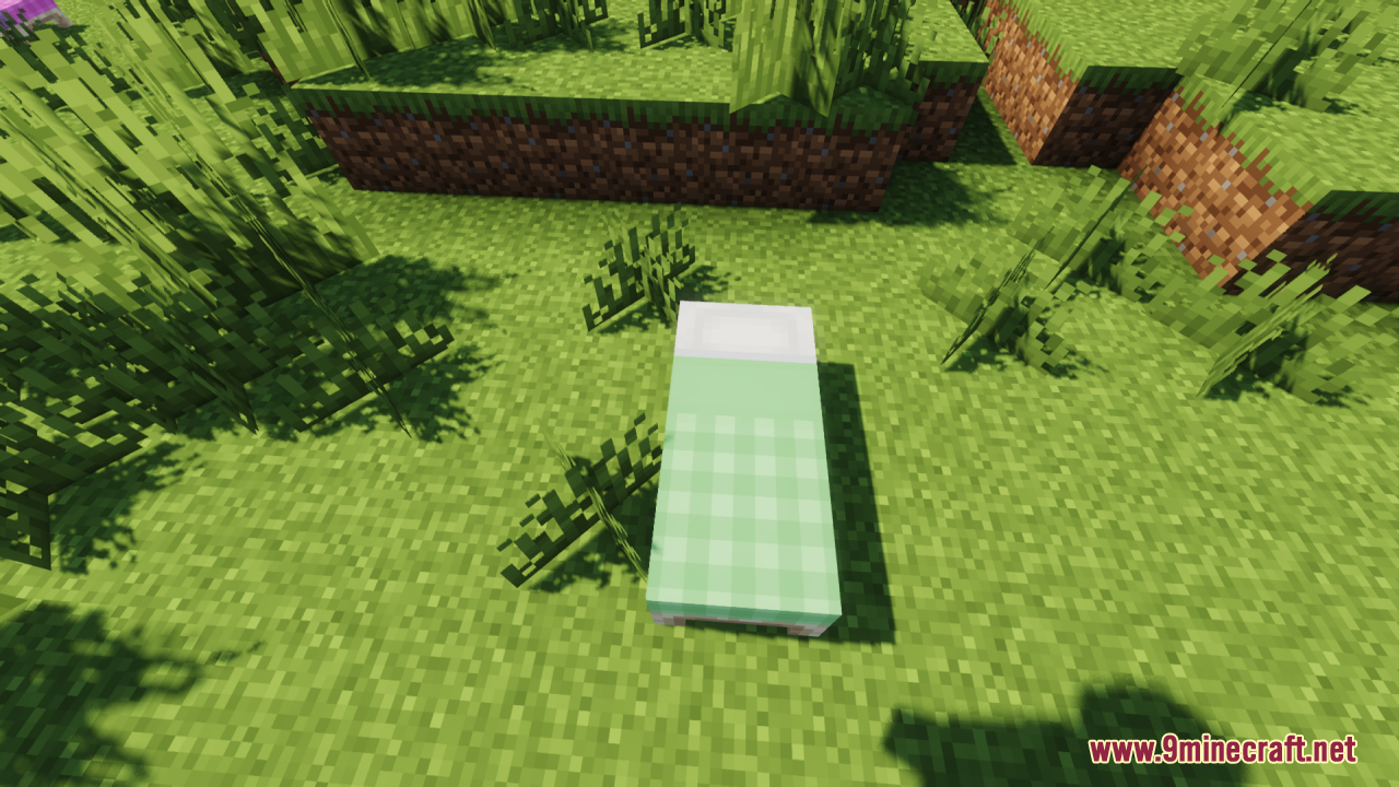 Cozy Nook Beds Resource Pack Screenshot 4 A single Minecraft bed with a green plaid blanket on grass