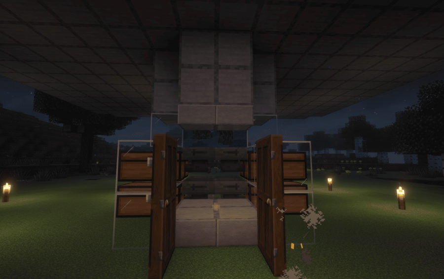 A compact resin farm design with chests and open wooden doors at night
