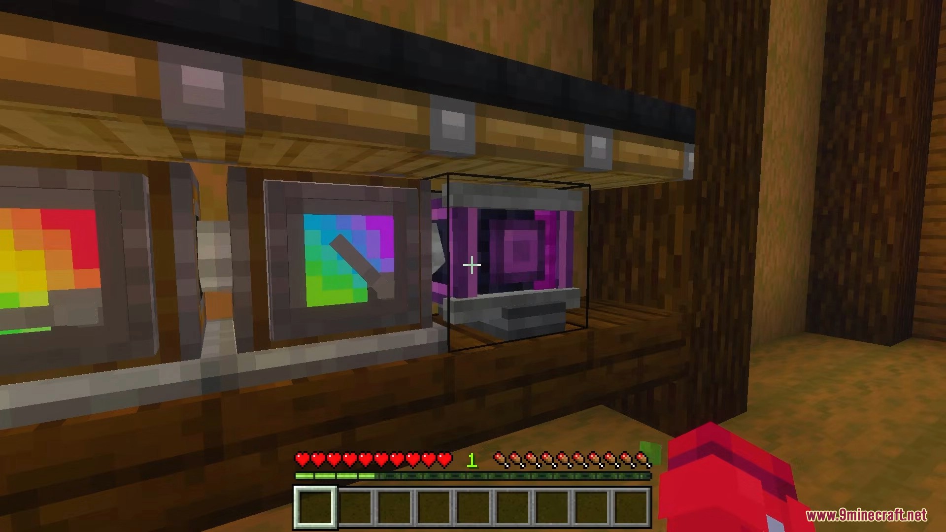 A player interacting with a purple machine block with a colorful screen