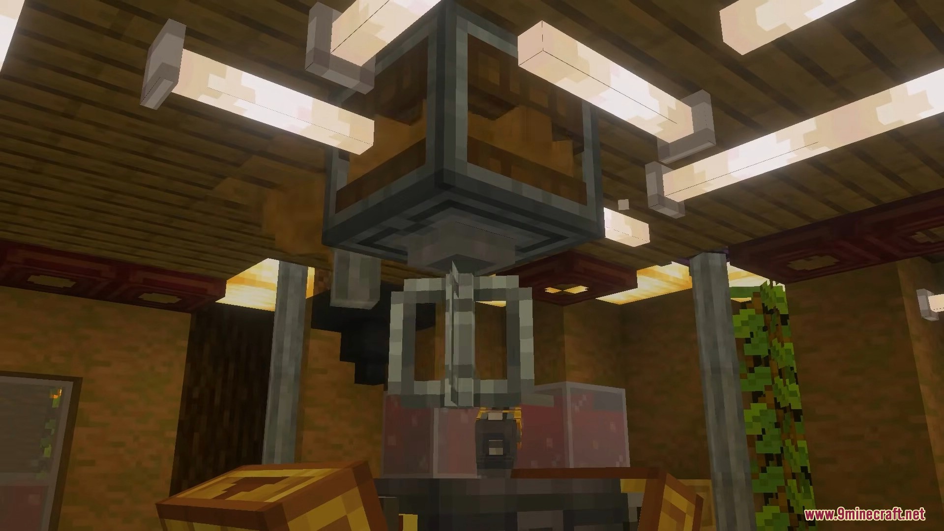 Mechanical mixer machine hanging from the ceiling above a crafting basin