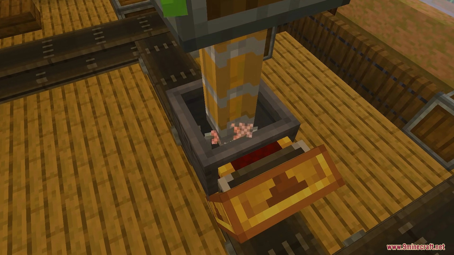 Mechanical press crushing items in a basin on a conveyor belt
