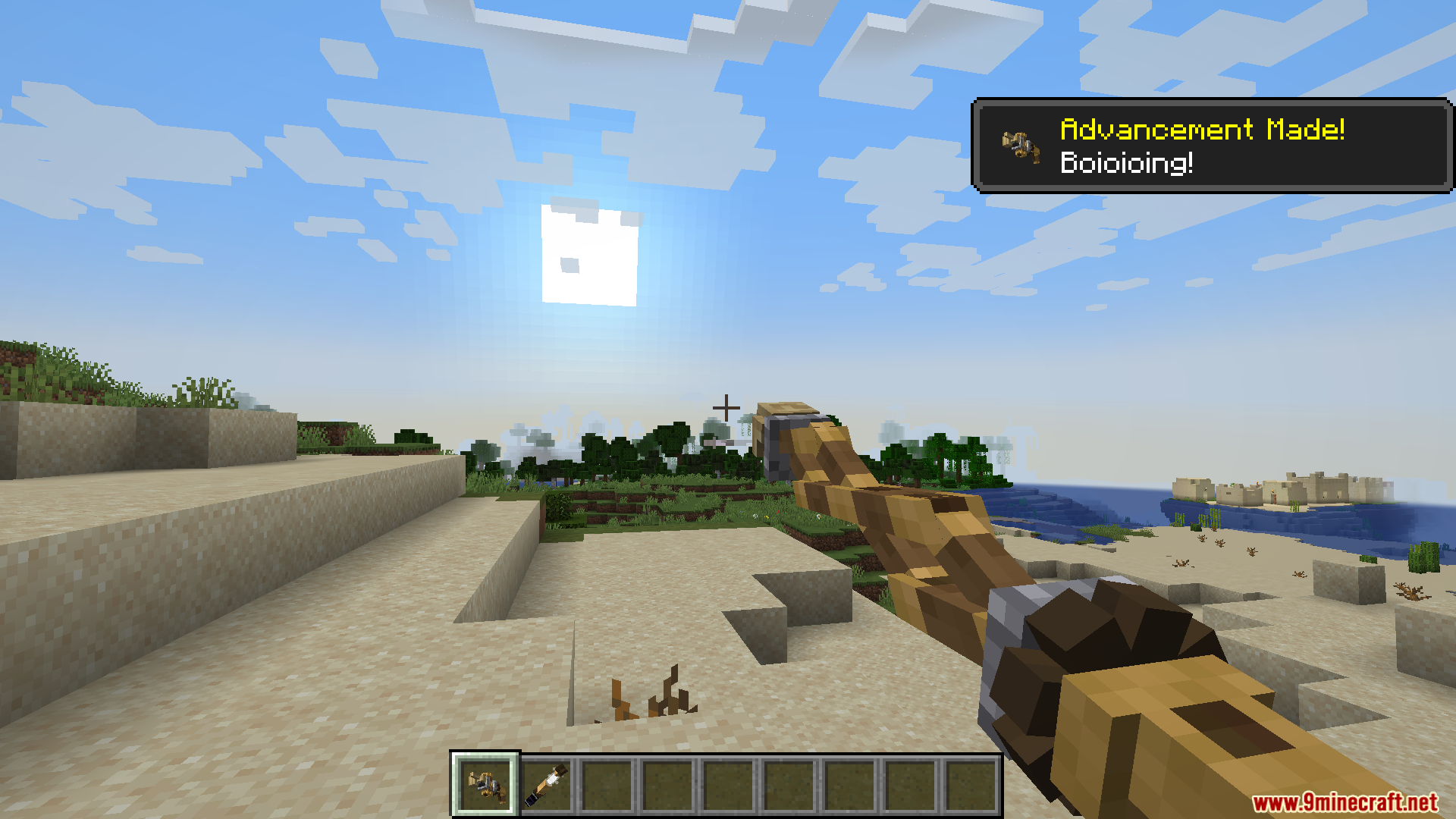 Player holding a fishing rod on a sandy beach