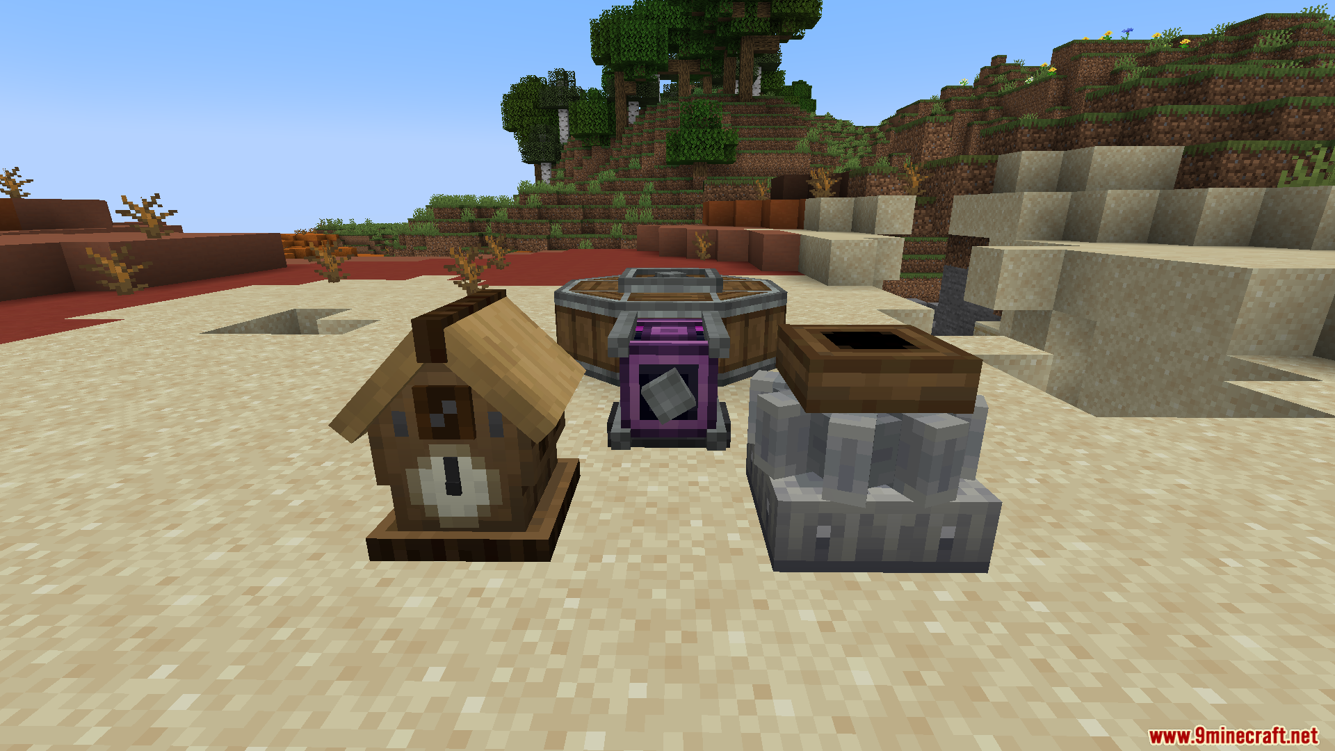 Cuckoo clock, barrel, Schematicannon, and grindstone on sand