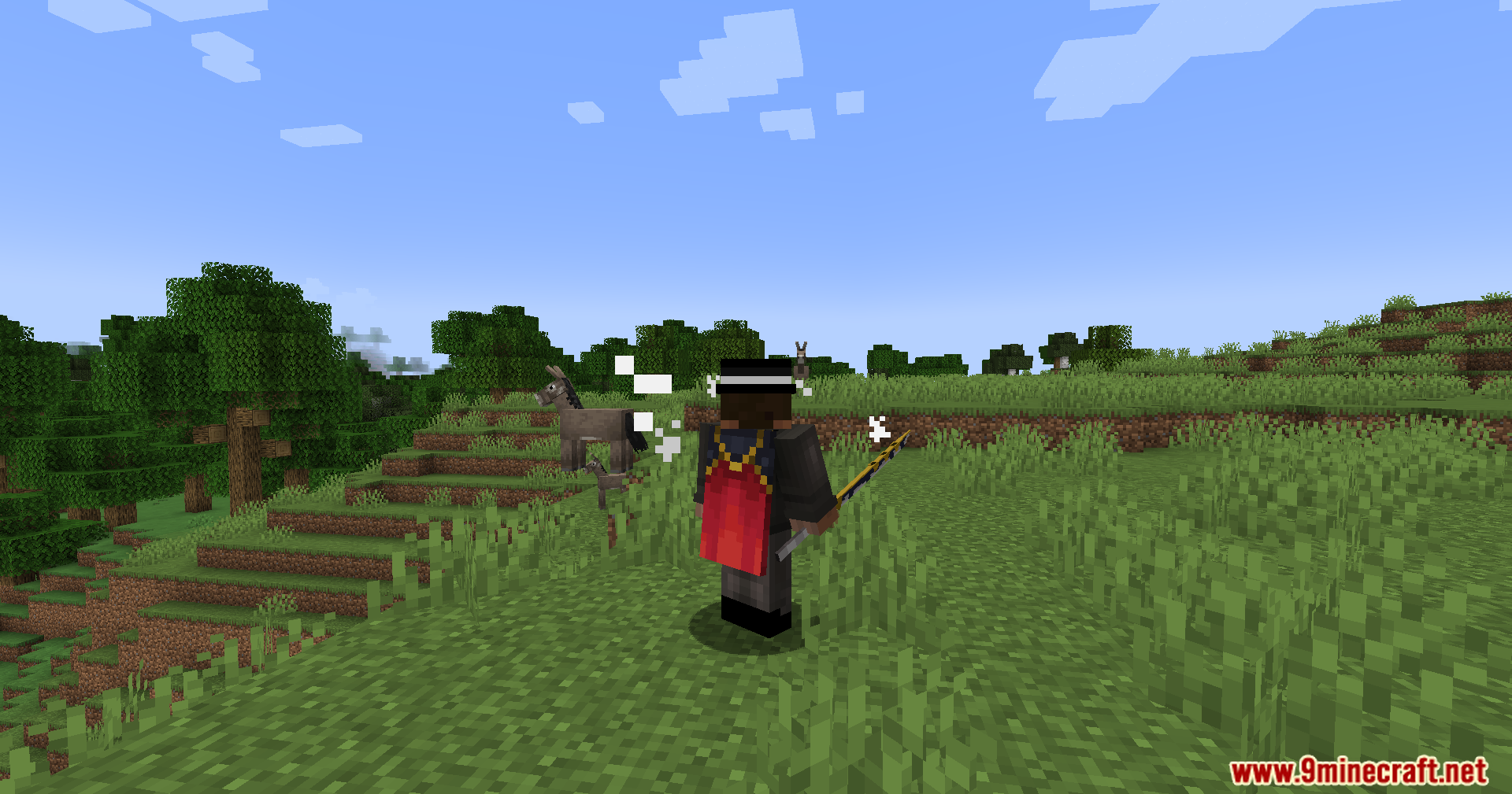 Player character with a red cape holding a magical staff