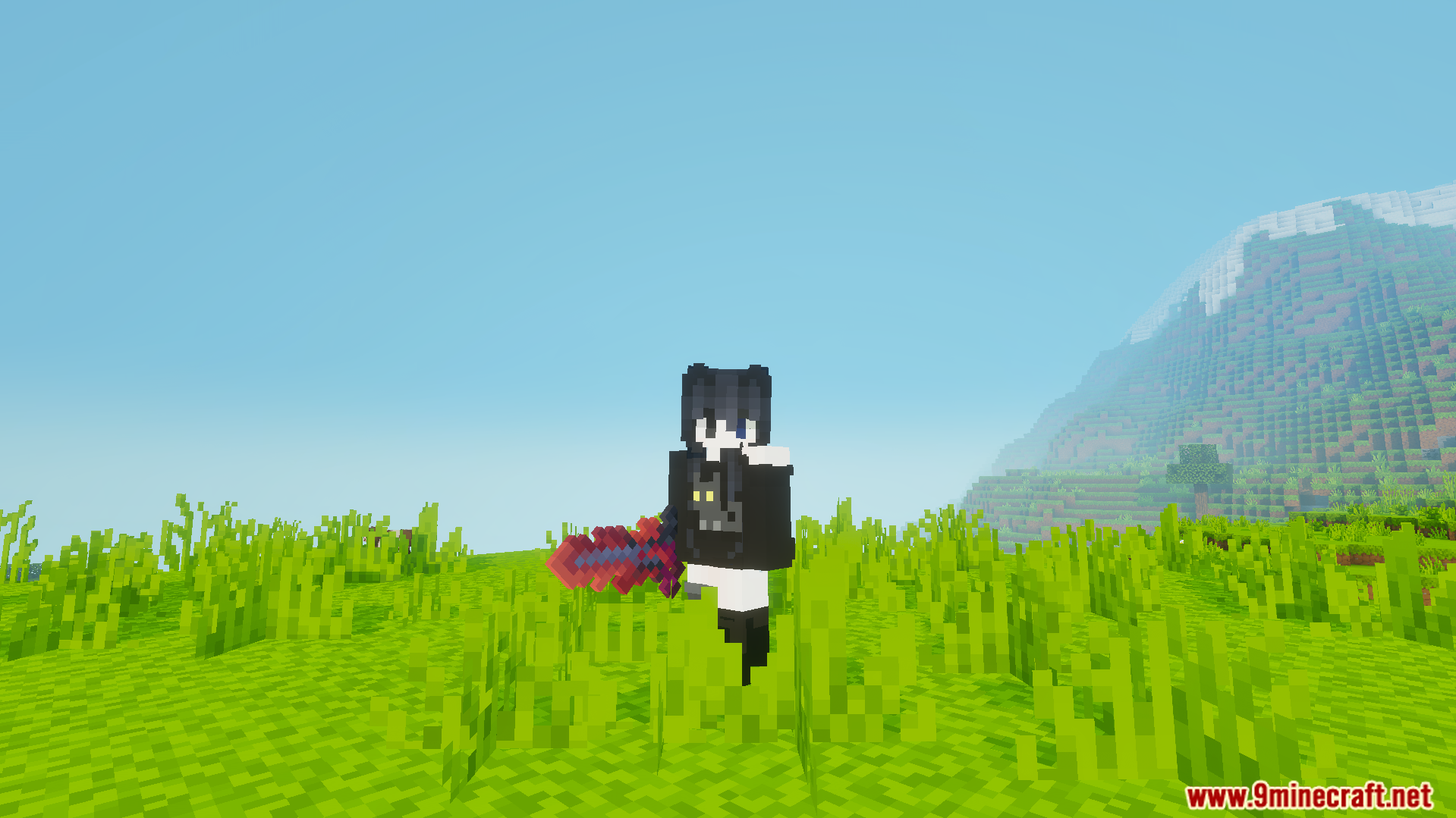 Player character standing in tall grass holding a red and purple custom sword