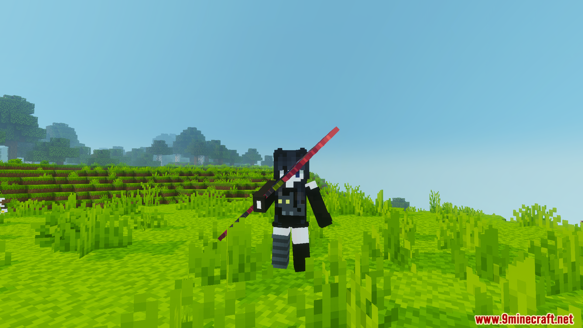Player holding a long red spear in a grassy field