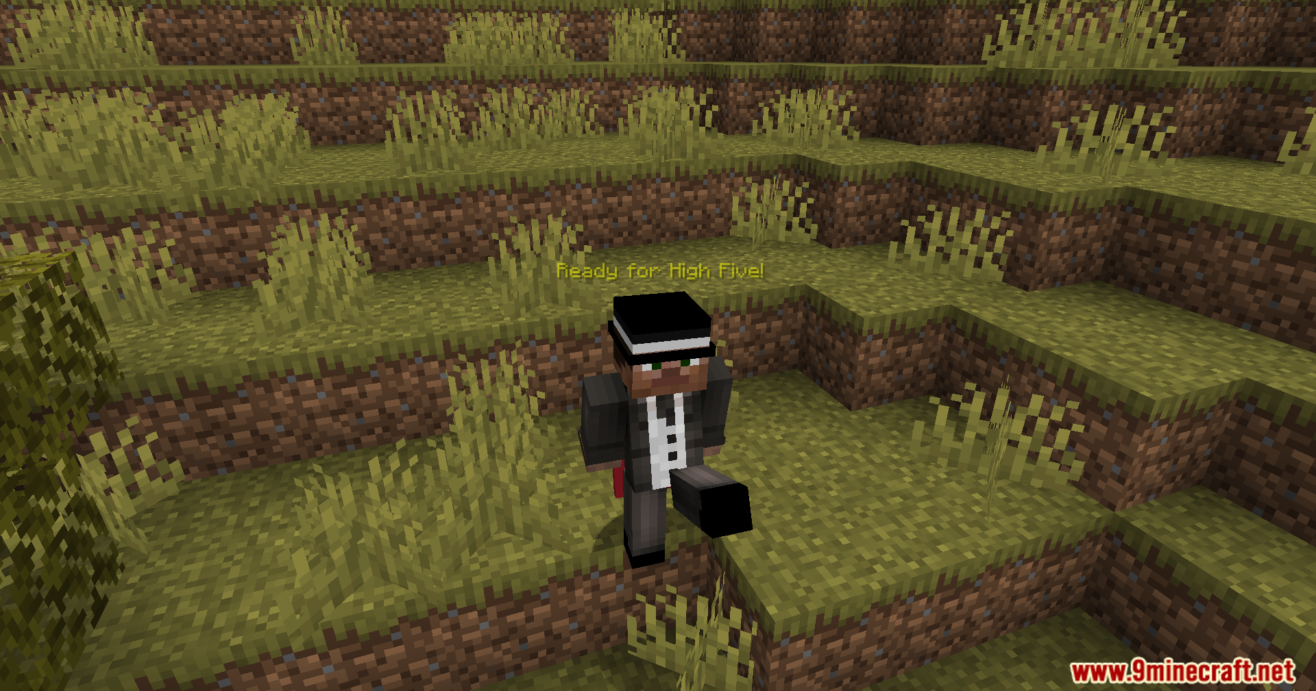 Player in a suit performing a kicking animation for a high five
