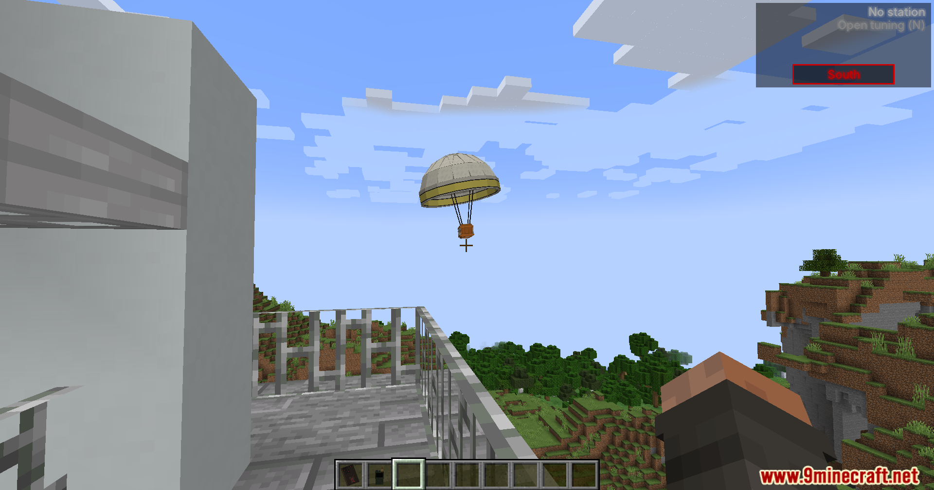 A parachute airdrop descends from the sky in Minecraft