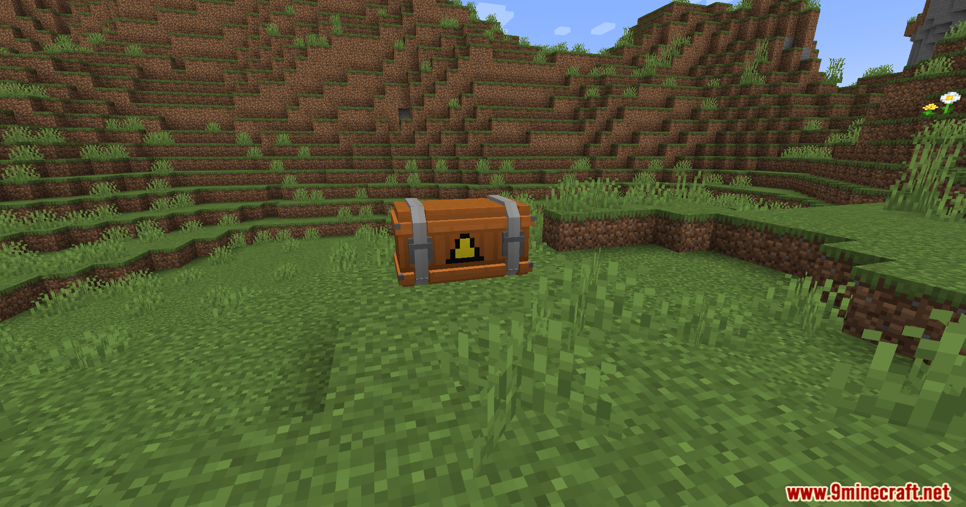 An airdrop supply crate has landed in a grassy field