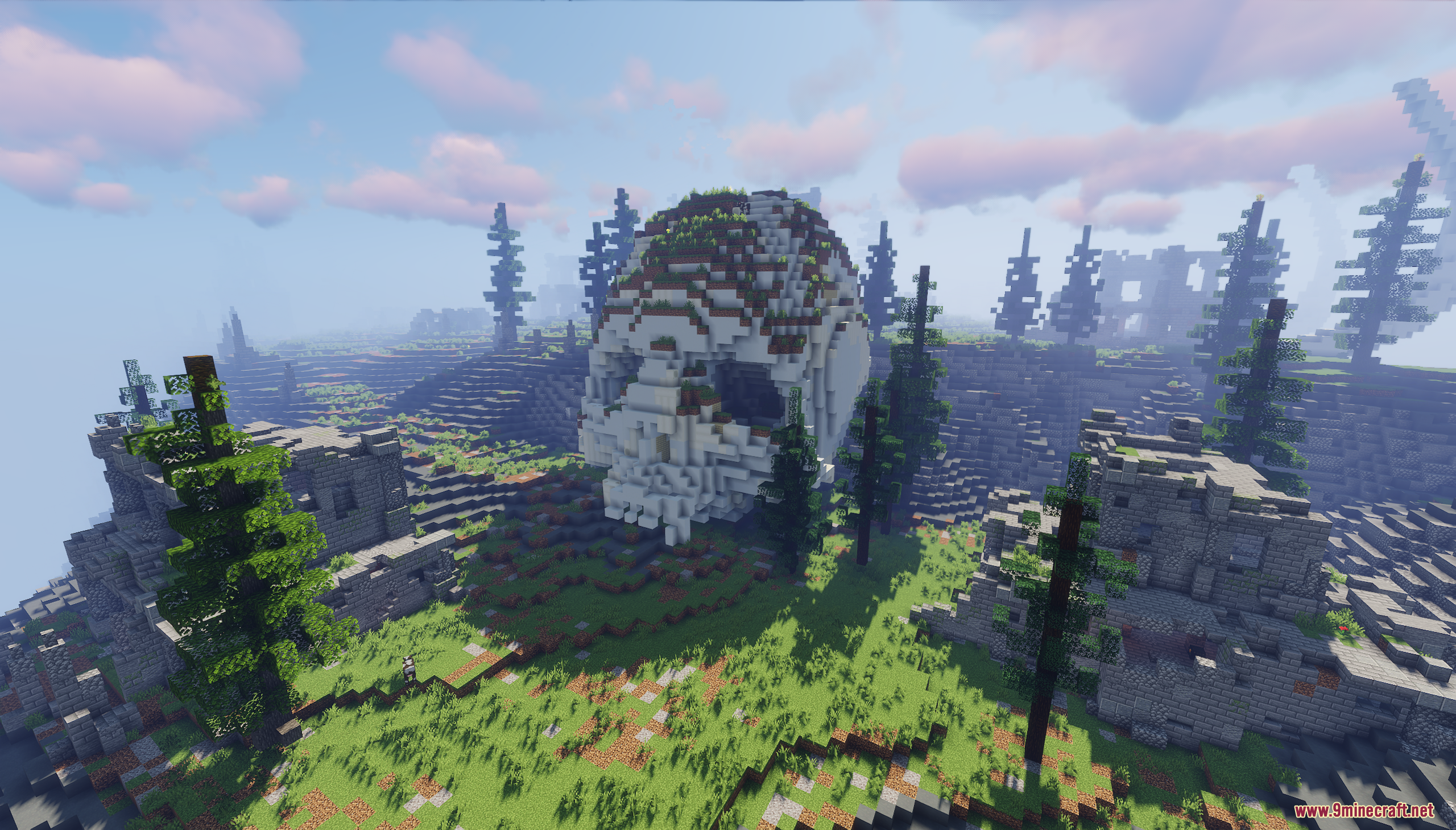 A giant white skull resting on a grassy hillside