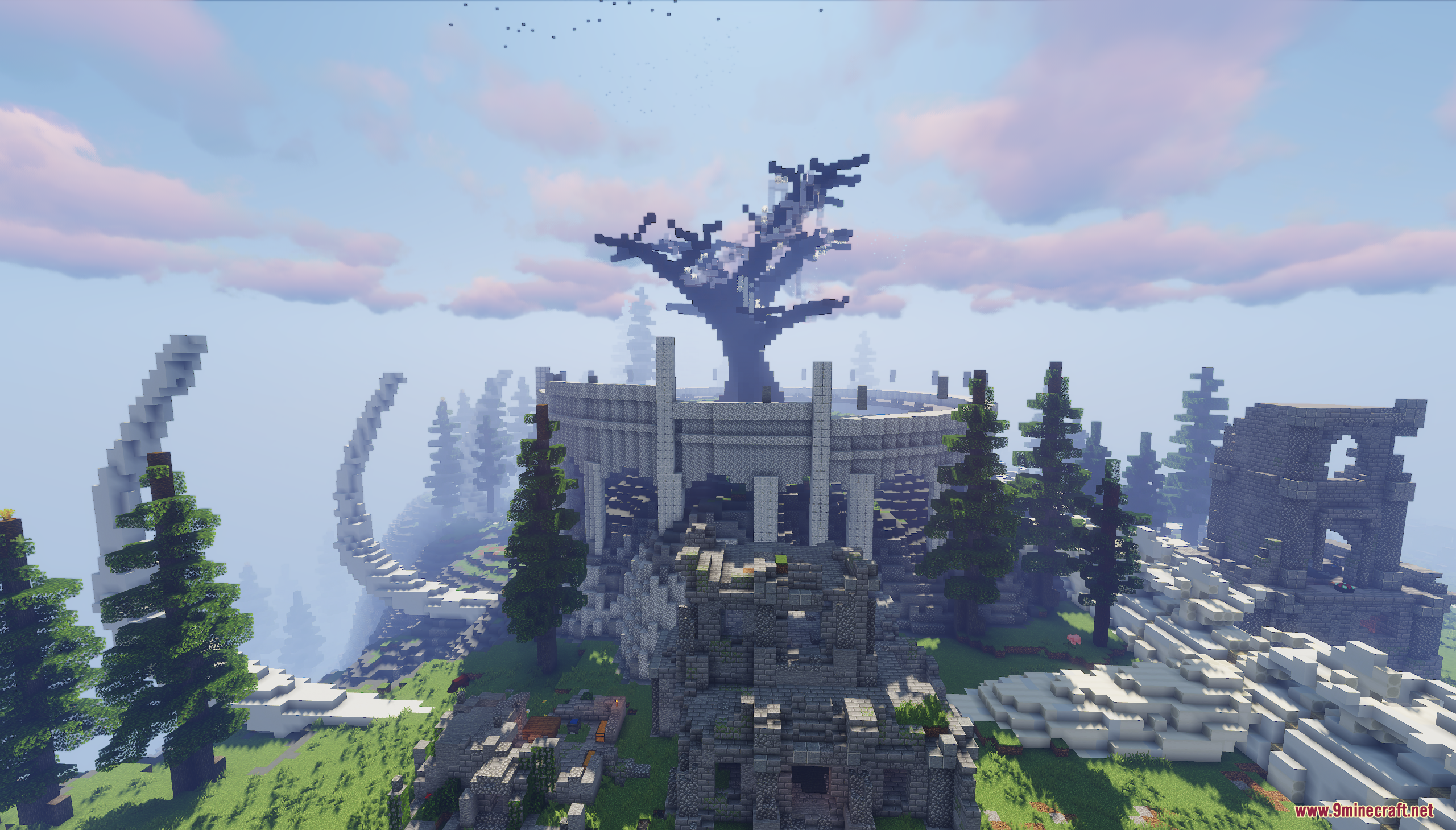 A circular stone fortress with a large dead tree
