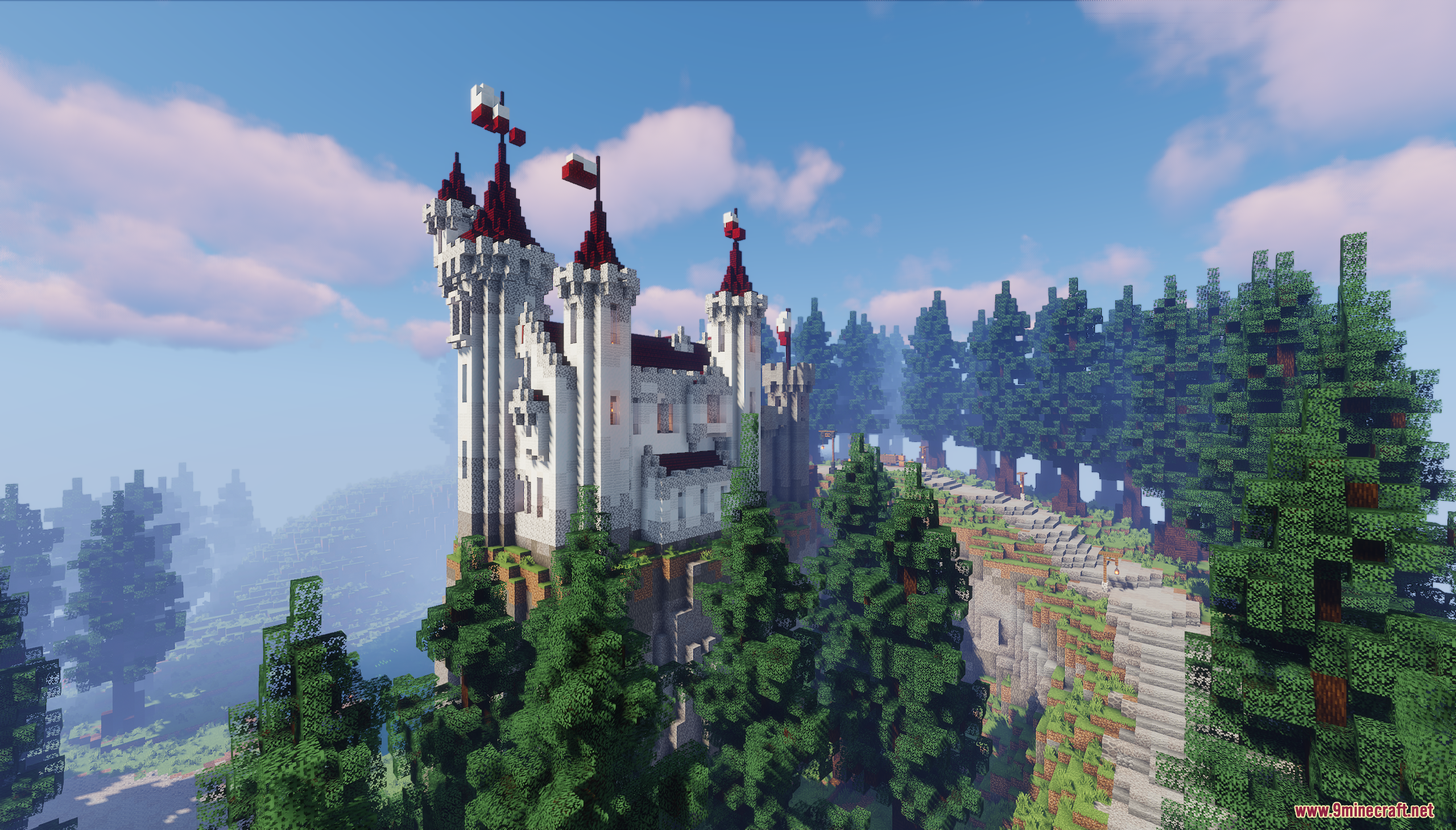 A white castle with red roofs towers above the forest