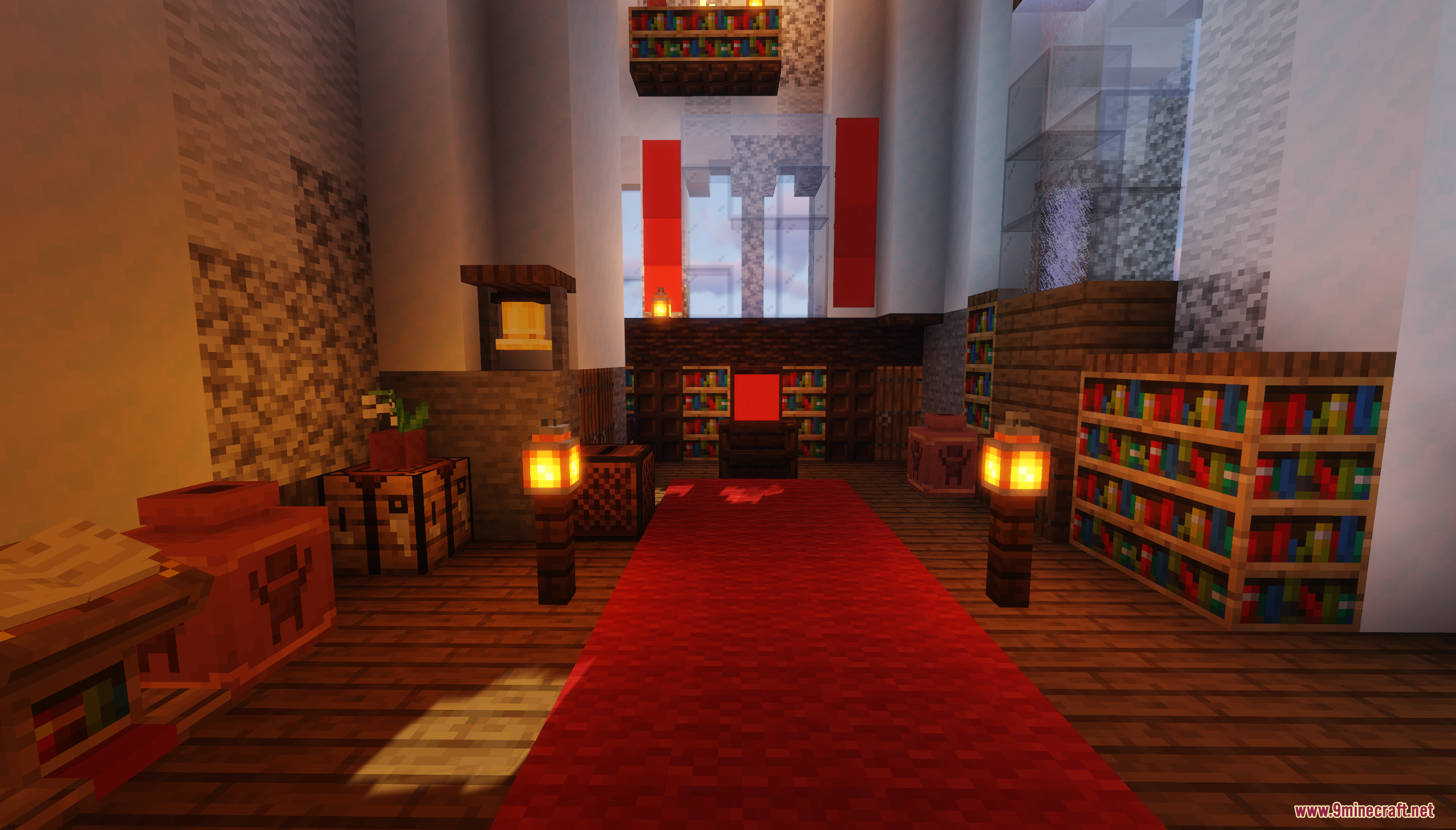 A castle throne room with a red carpet and bookshelves