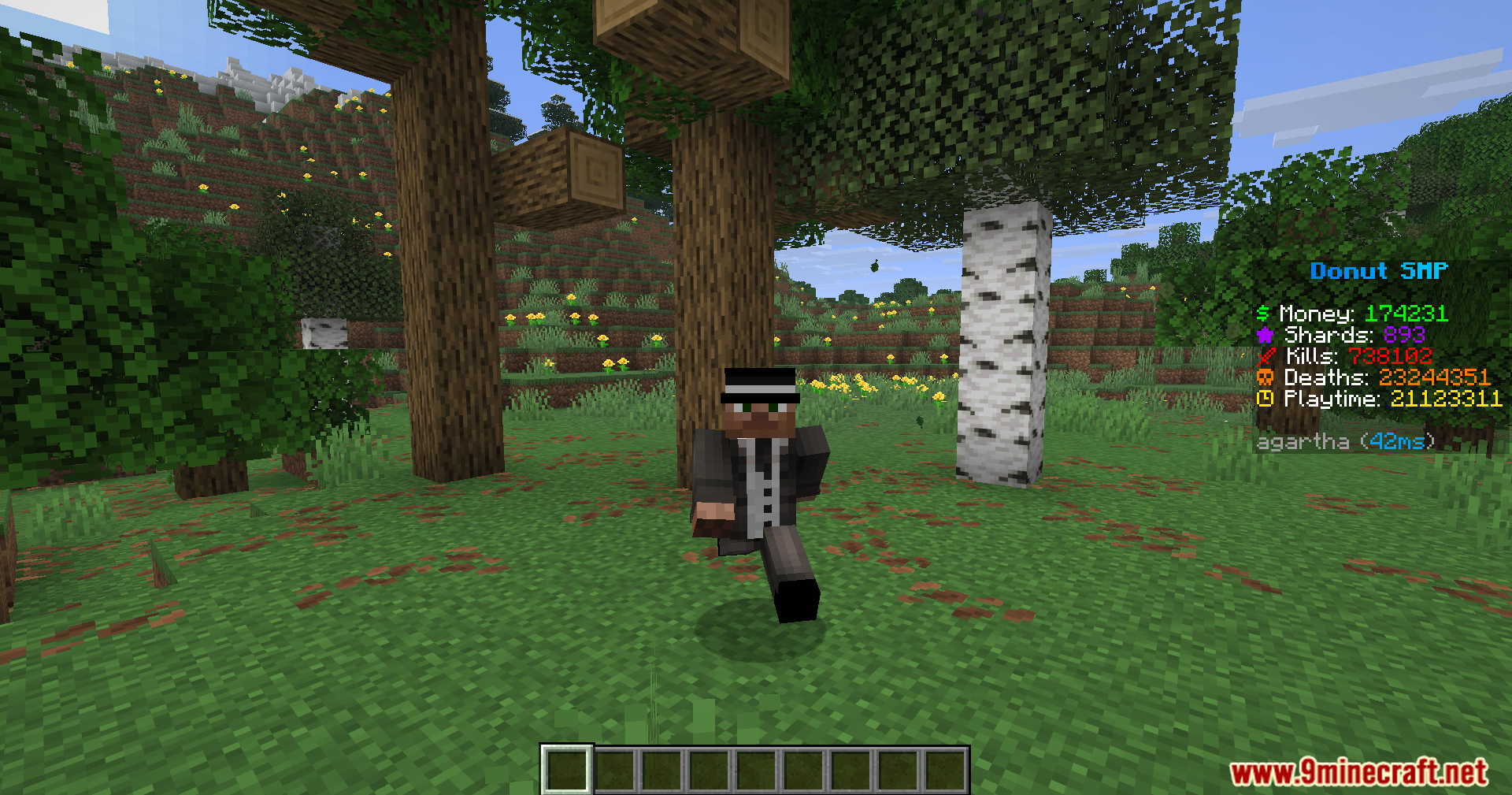 Player character in a suit running through a forest with a scoreboard
