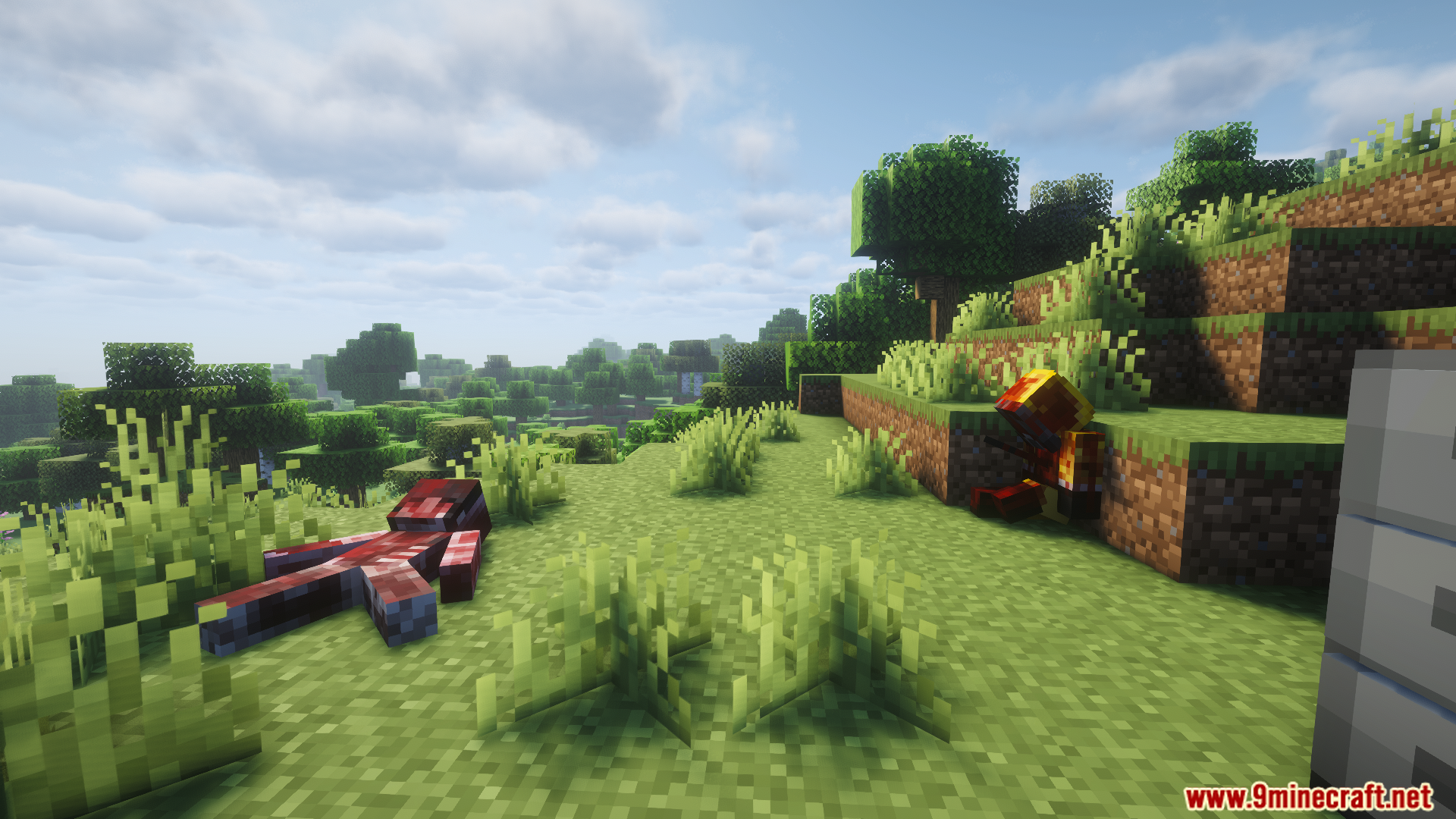 Lootable dead bodies lying in a grassy Minecraft field