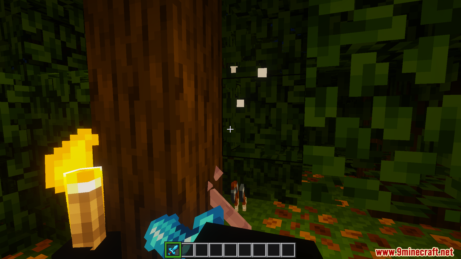 DoubleHands Addon Screenshot 7 player holds torch in left hand for bright light while holding diamond sword