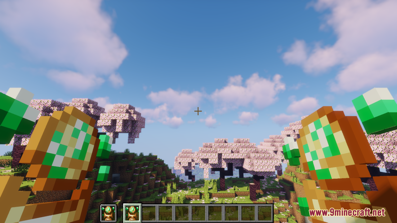 Earth Totem of Undying Resource Pack Screenshot 6 Player dual wielding custom earth totems in a cherry blossom biome