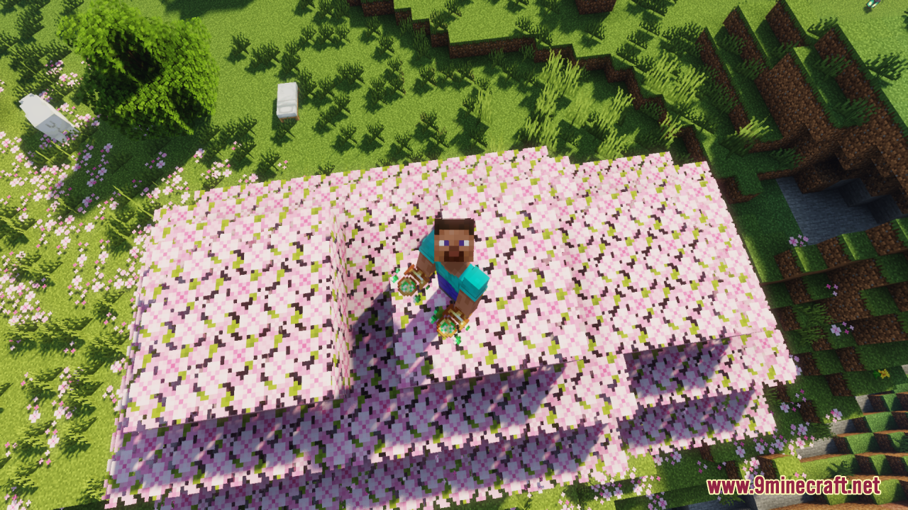 Earth Totem of Undying Resource Pack Screenshot 7 Player holding Earth Totems on a cherry blossom tree