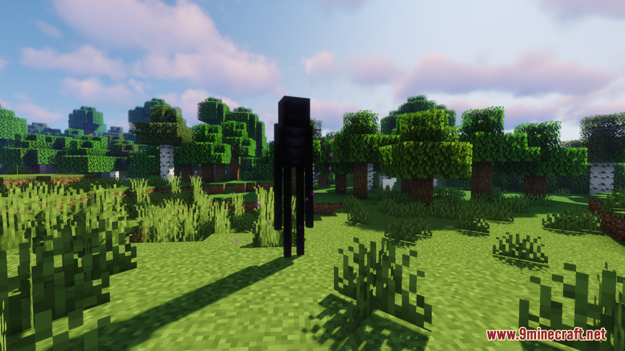 A tall black Enderman standing in a grassy forest biome during daytime