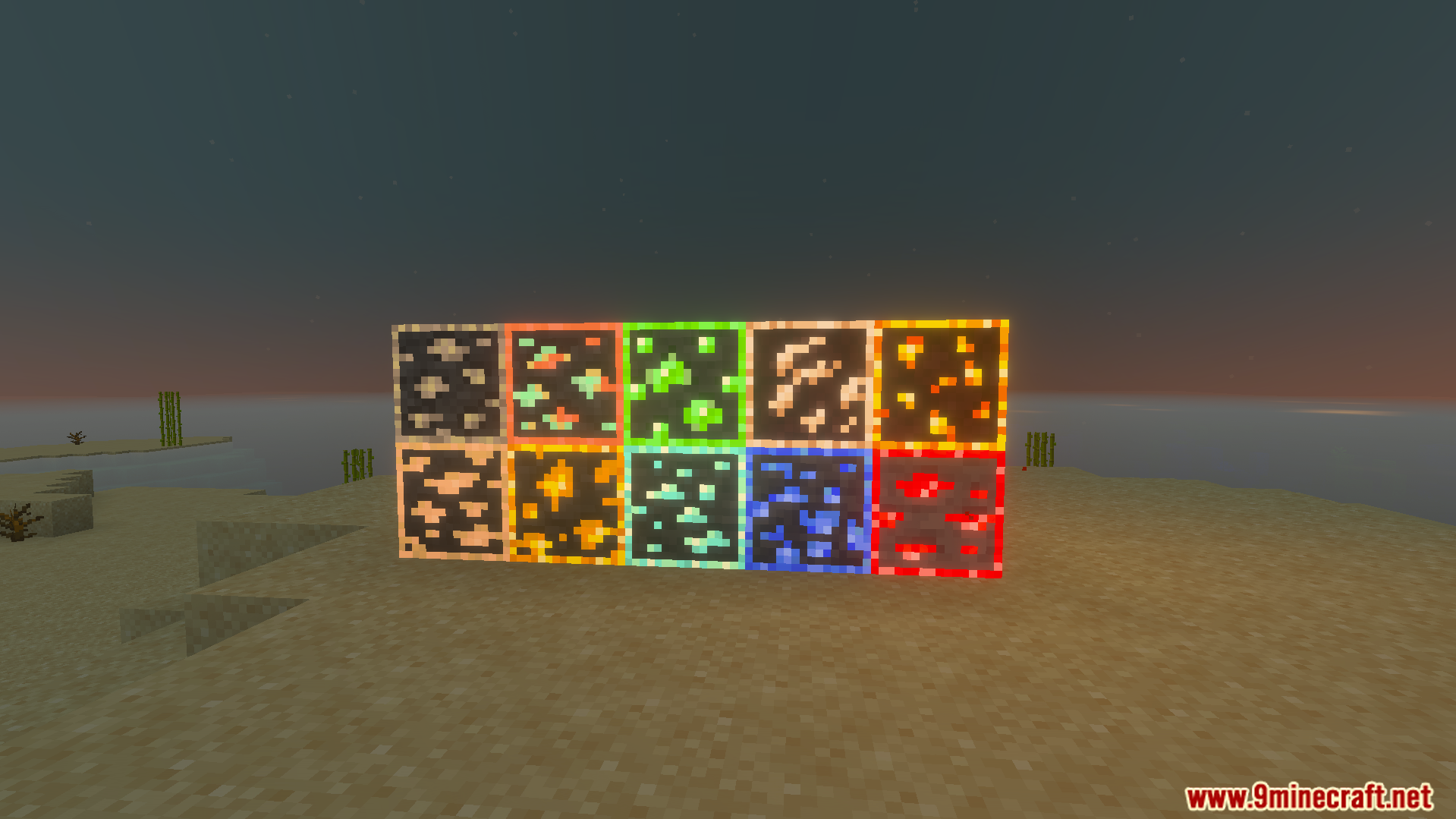 EuphrosyneLights Glowing Ores Texture Pack Screenshot 3 Glowing ore blocks displayed on sand in a Minecraft world