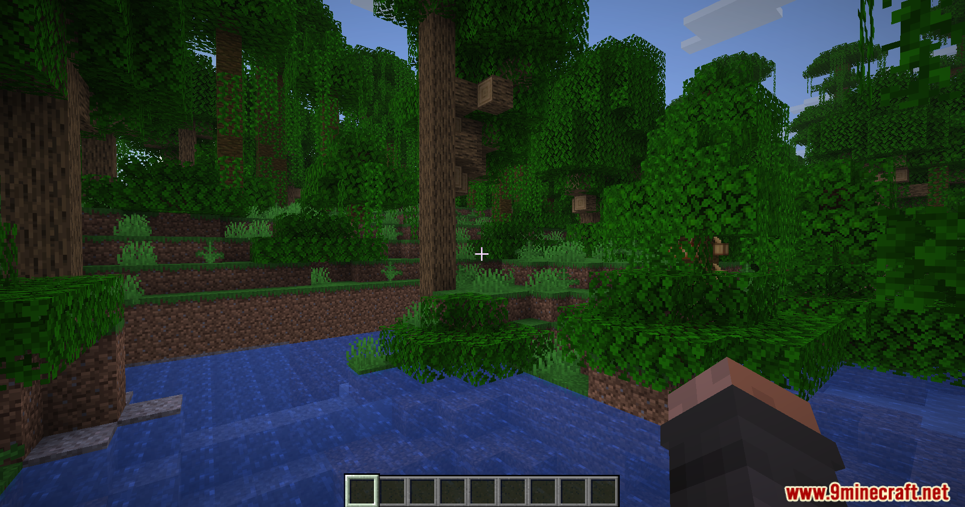 Fake Fabric Loader Mod Screenshot 2 First person perspective of a player looking at a dense green jungle biome