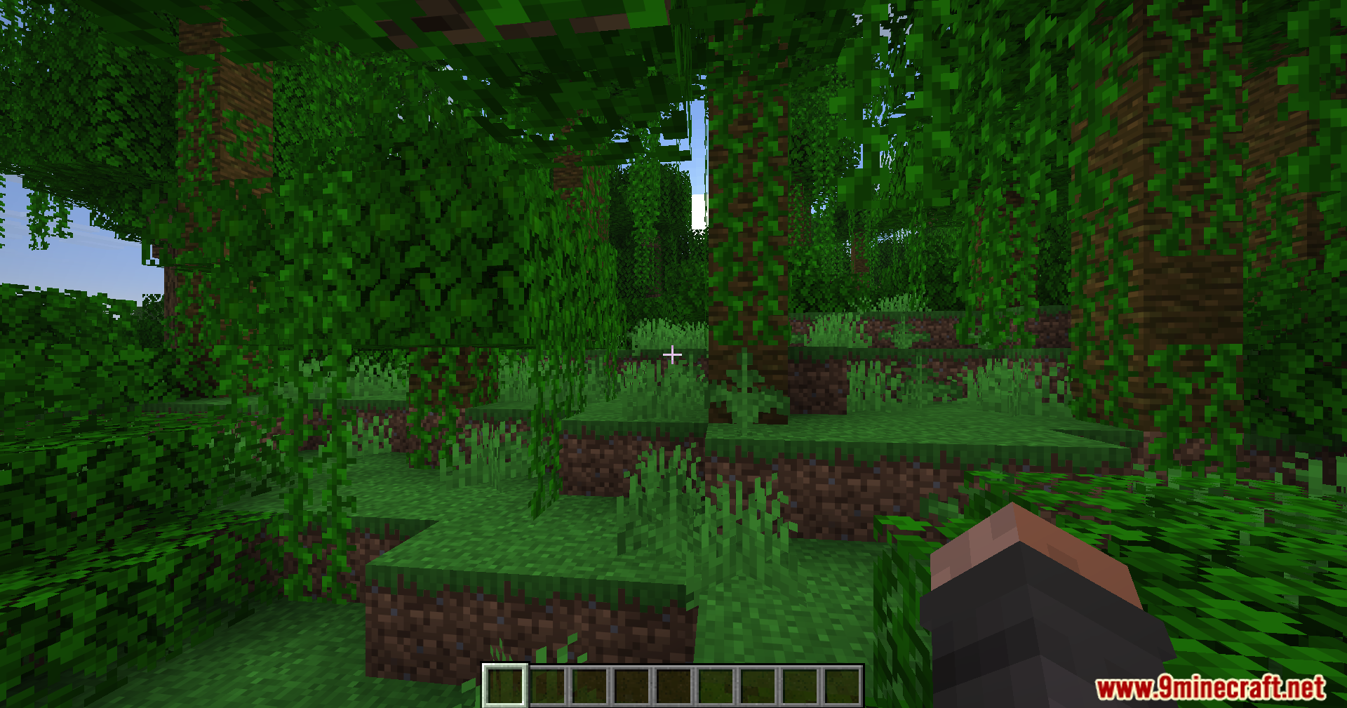 Fake Fabric Loader Mod Screenshot 3 Player exploring a dense jungle biome with tall trees covered in green vines