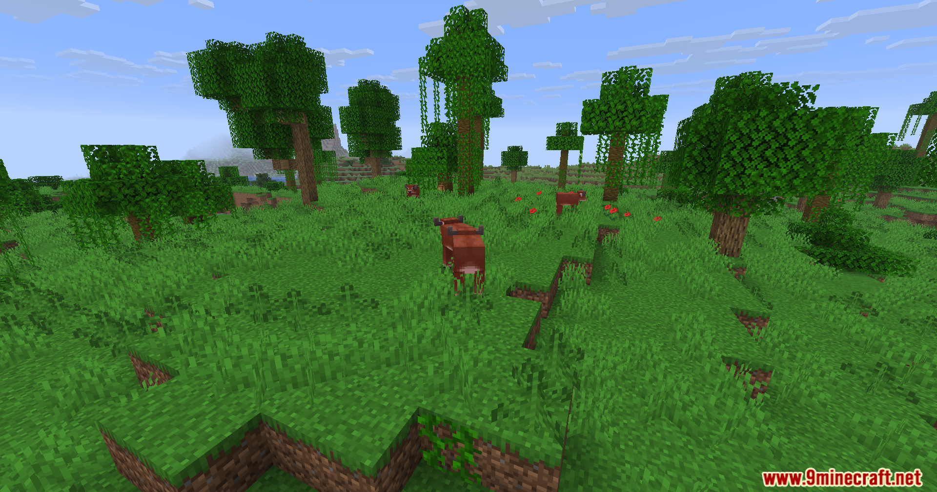 Fake Fabric Loader Mod Screenshot 9 Brown cows grazing in a grassy forest biome with trees and vines