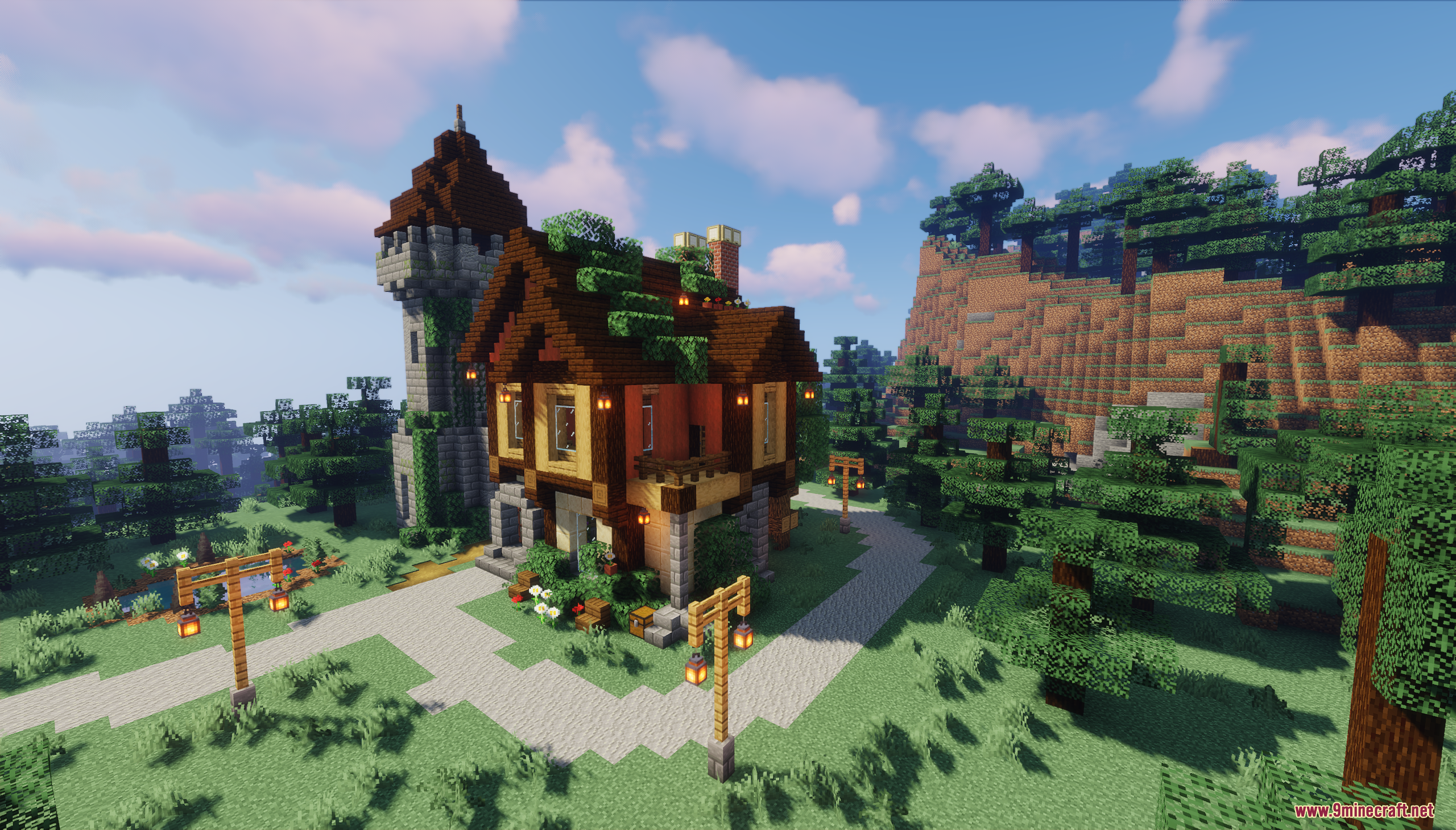 A timber-frame house and stone tower surrounded by a forest
