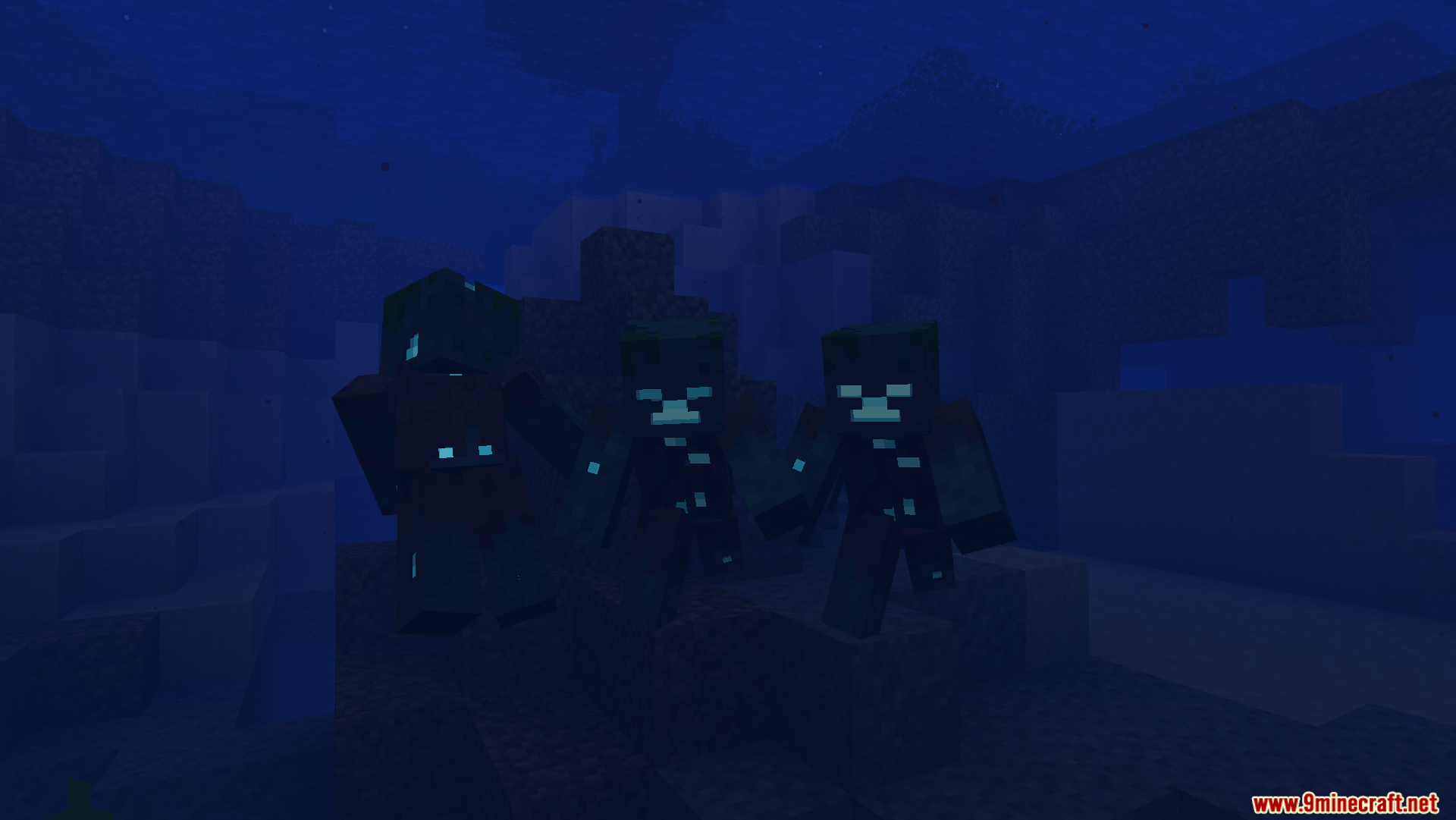 Drowned mobs with glowing blue eyes and bodies swimming deep underwater