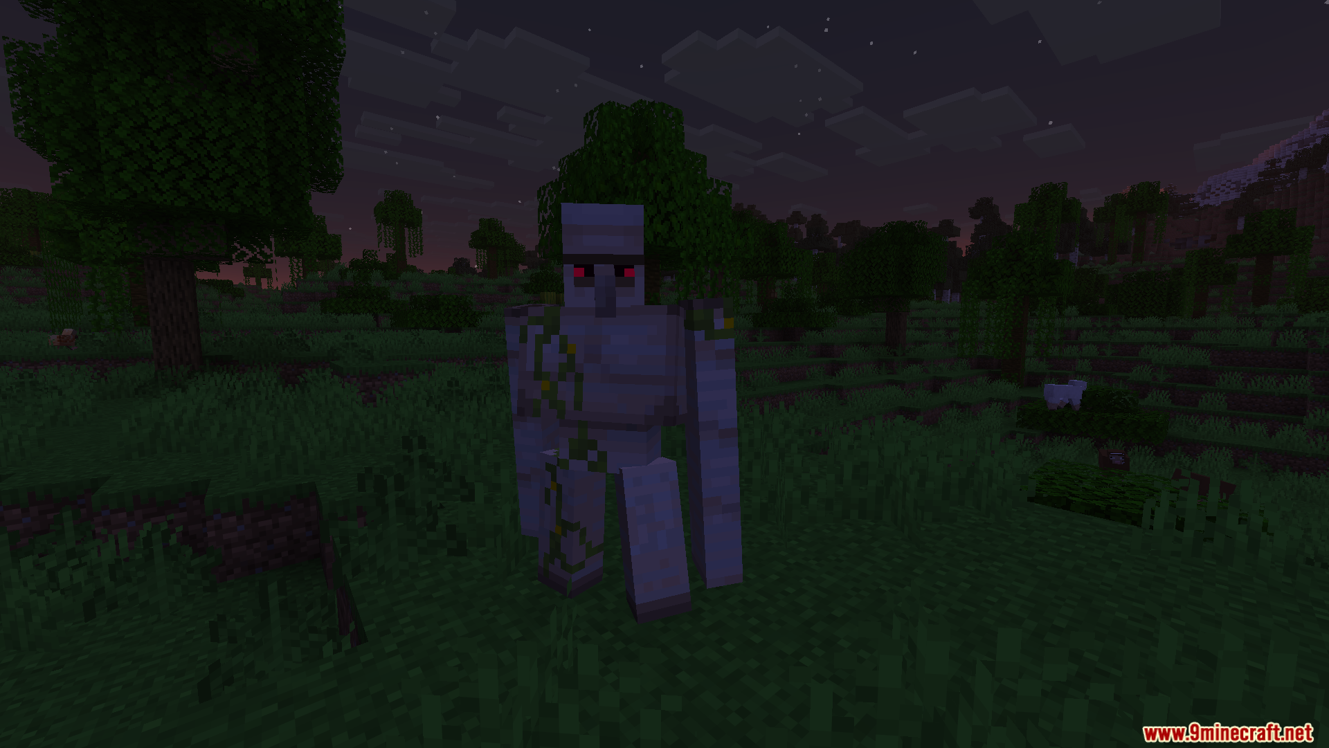 An Iron Golem with glowing red eyes standing in a dark grassy field