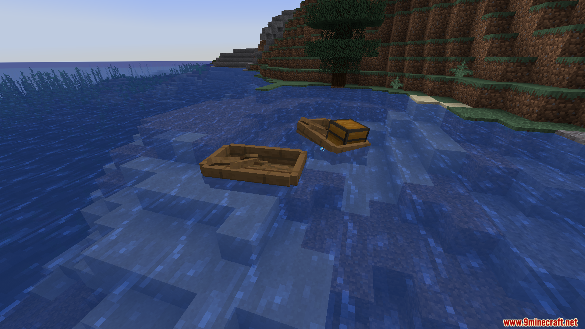 A regular wooden boat and a boat with a chest floating in water