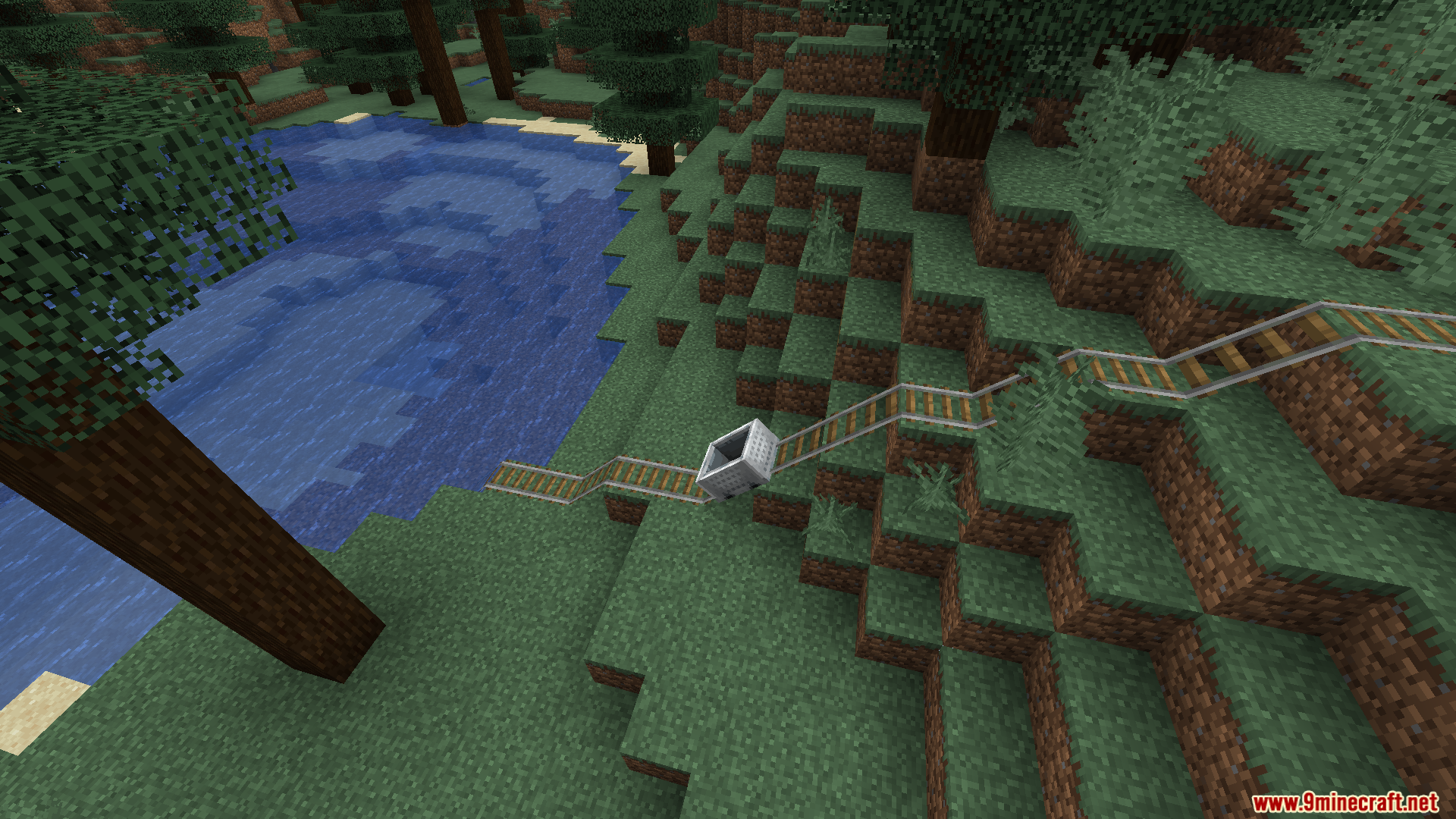 Minecart wobbling on angled rails down a grassy hill next to water