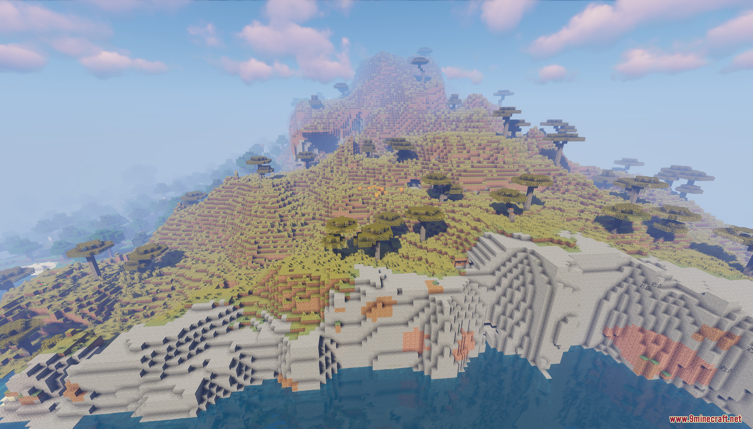 A large savanna island with a curved, cliff-lined coast