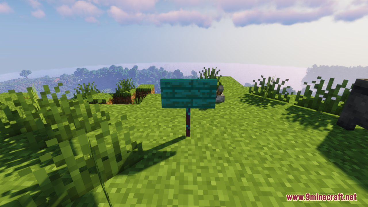 A thick 3D warped sign standing in the grass