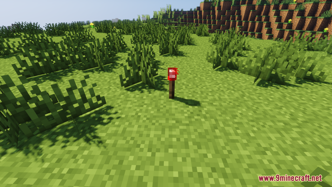 A 3D redstone torch model on a fence post