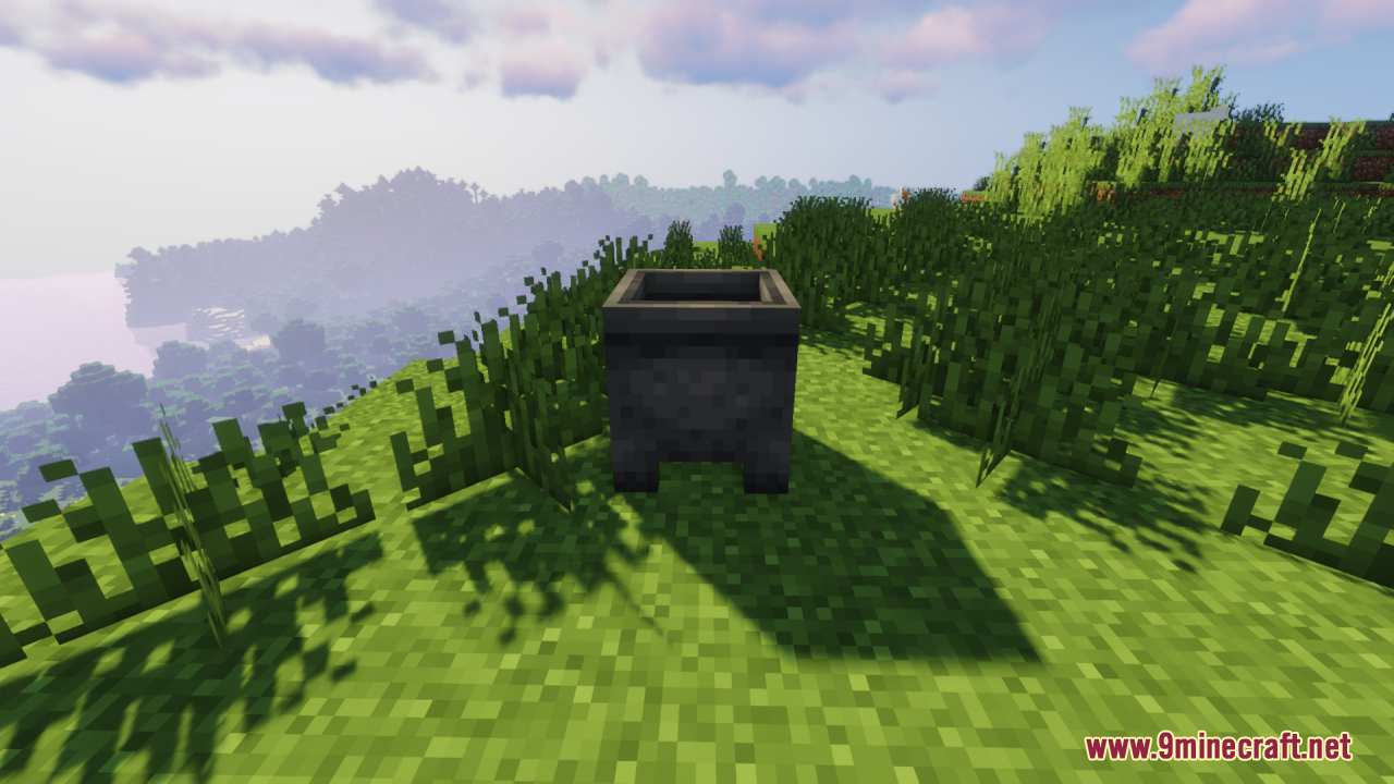 A detailed 3D cauldron model sitting on the grass
