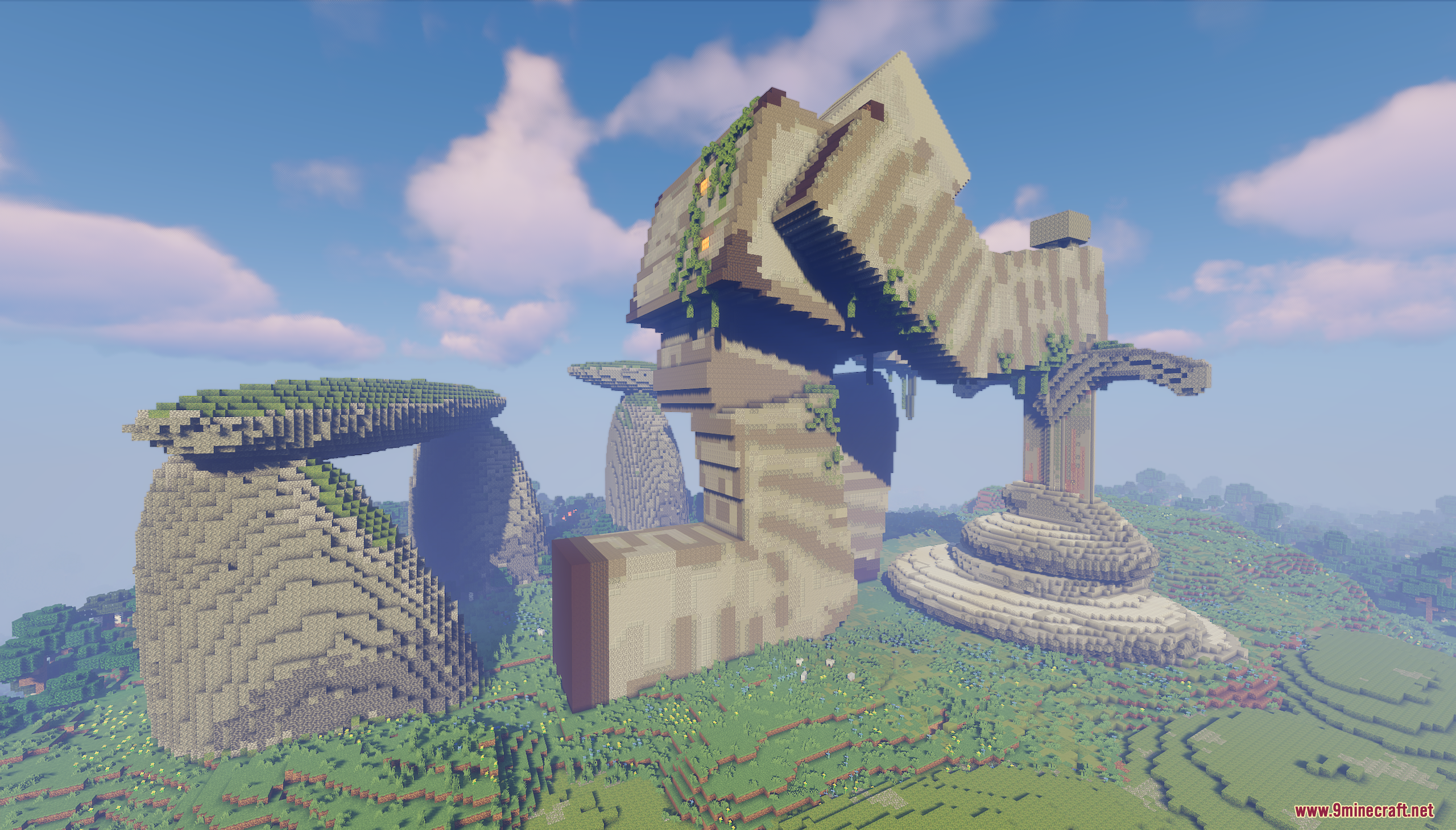 Massive iron golem statue built in a grassy landscape with large stone pillars