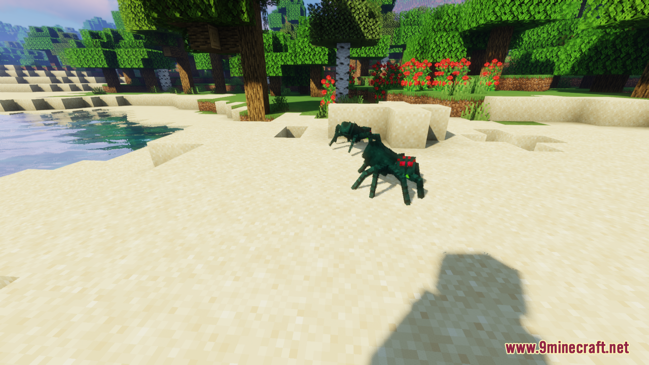 Two spiders with detailed models and glowing eyes on a sandy beach
