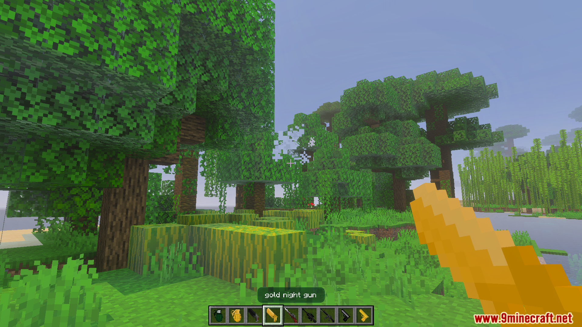 Gun Expansion Addon Screenshot 5 Player holding a gold night gun in a forest biome
