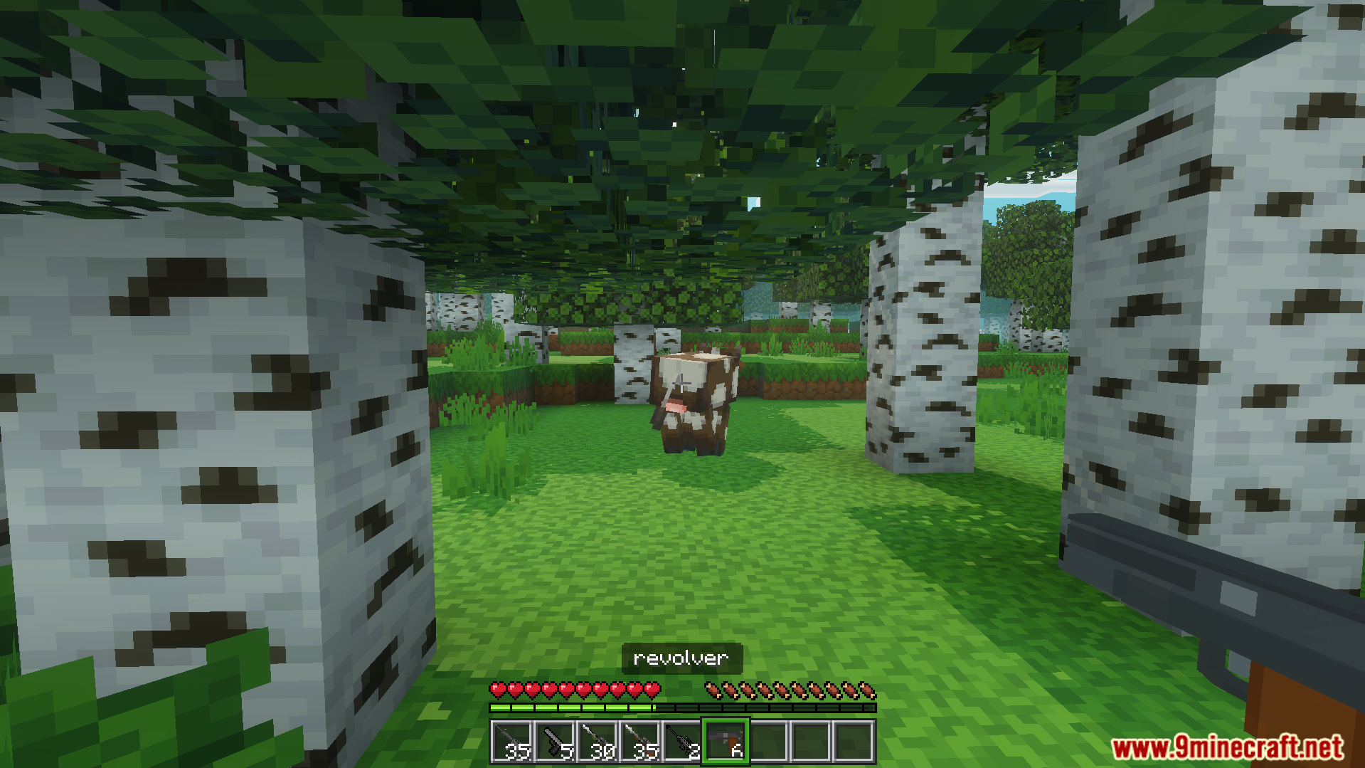 Gun Plus Addon Screenshot 7 Player holding a revolver gun aiming at a cow in birch forest