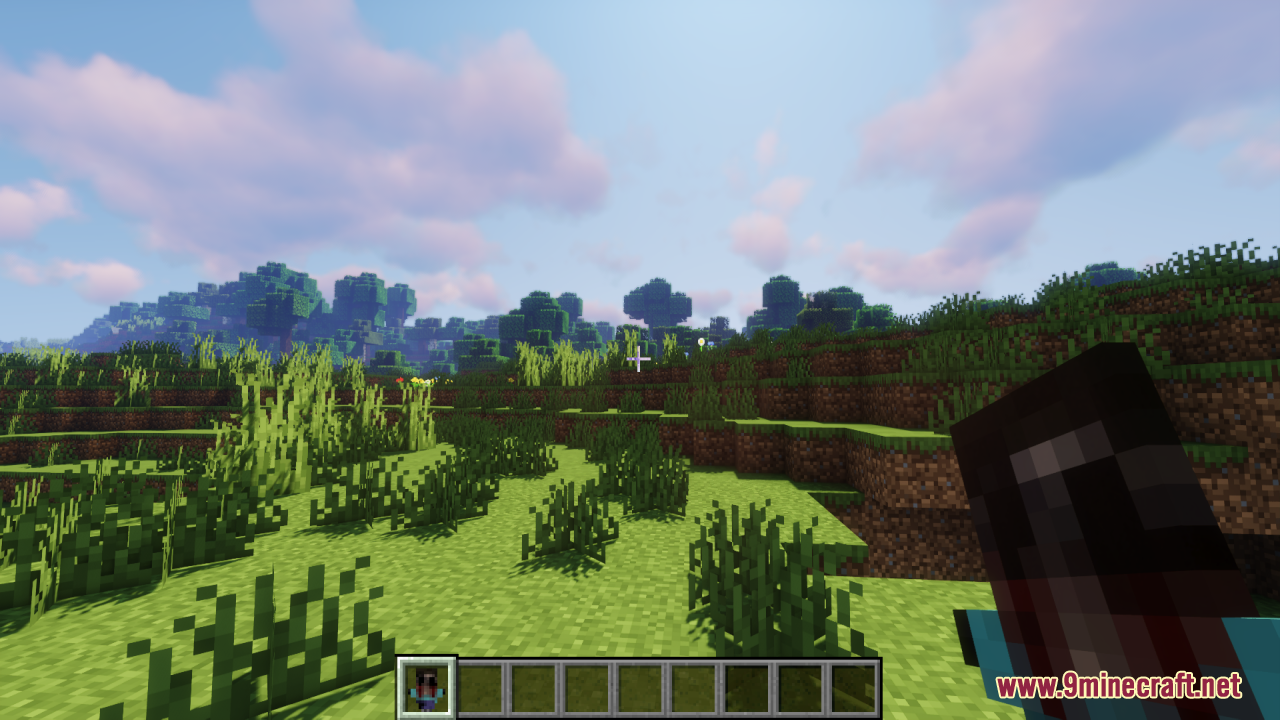 Holding the creepy custom totem item in the player's hand in a grassy biome