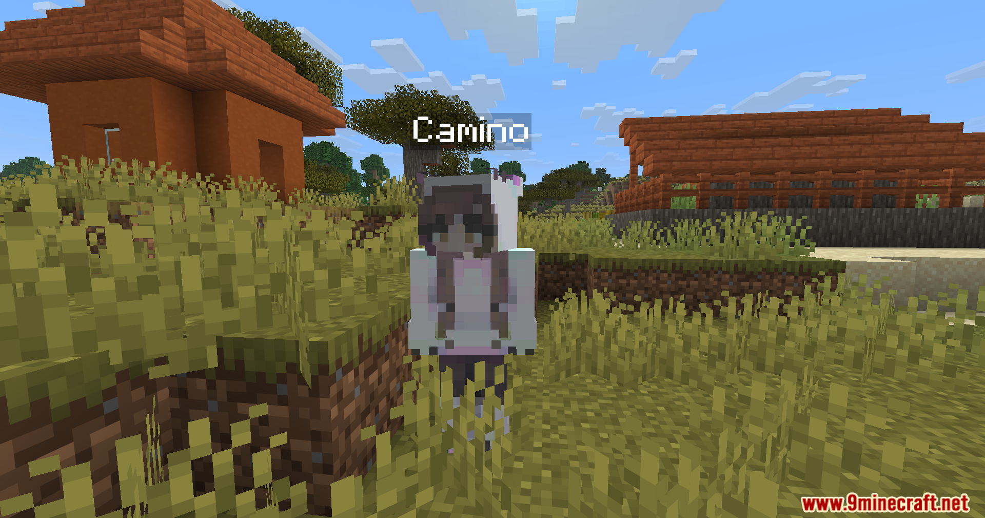 Humanoid Villagers Mod Screenshot 11 Humanoid villager named Camino standing outside in a grassy village area