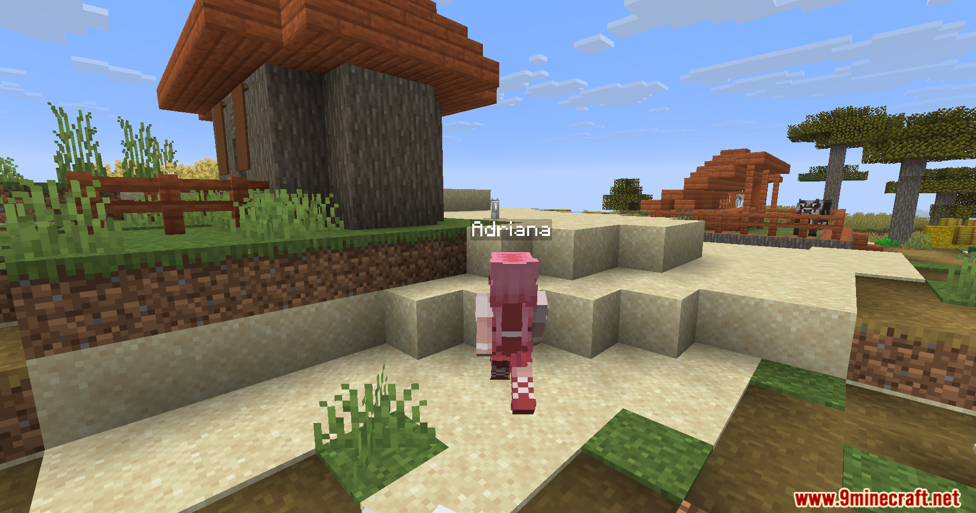 Humanoid Villagers Mod Screenshot 9 Female humanoid villager named Adriana walking outside a village house