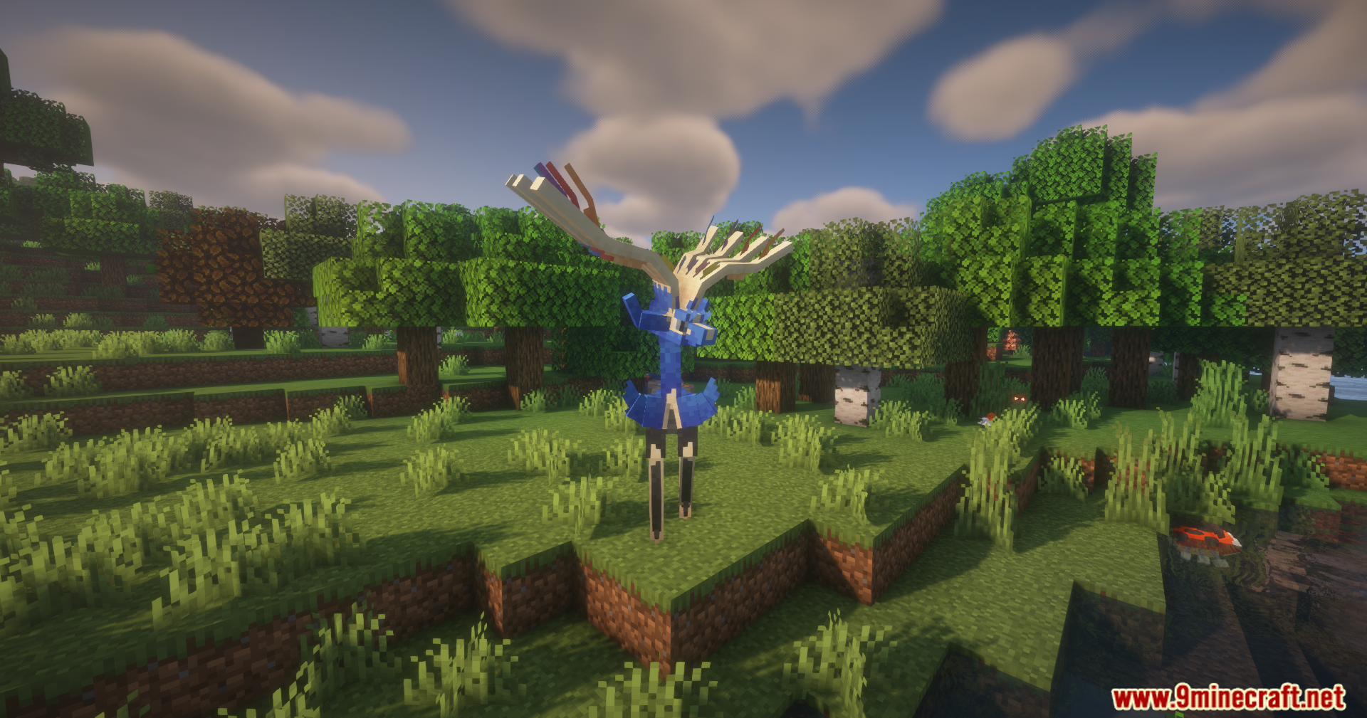 Xerneas standing on a grassy hill near a forest