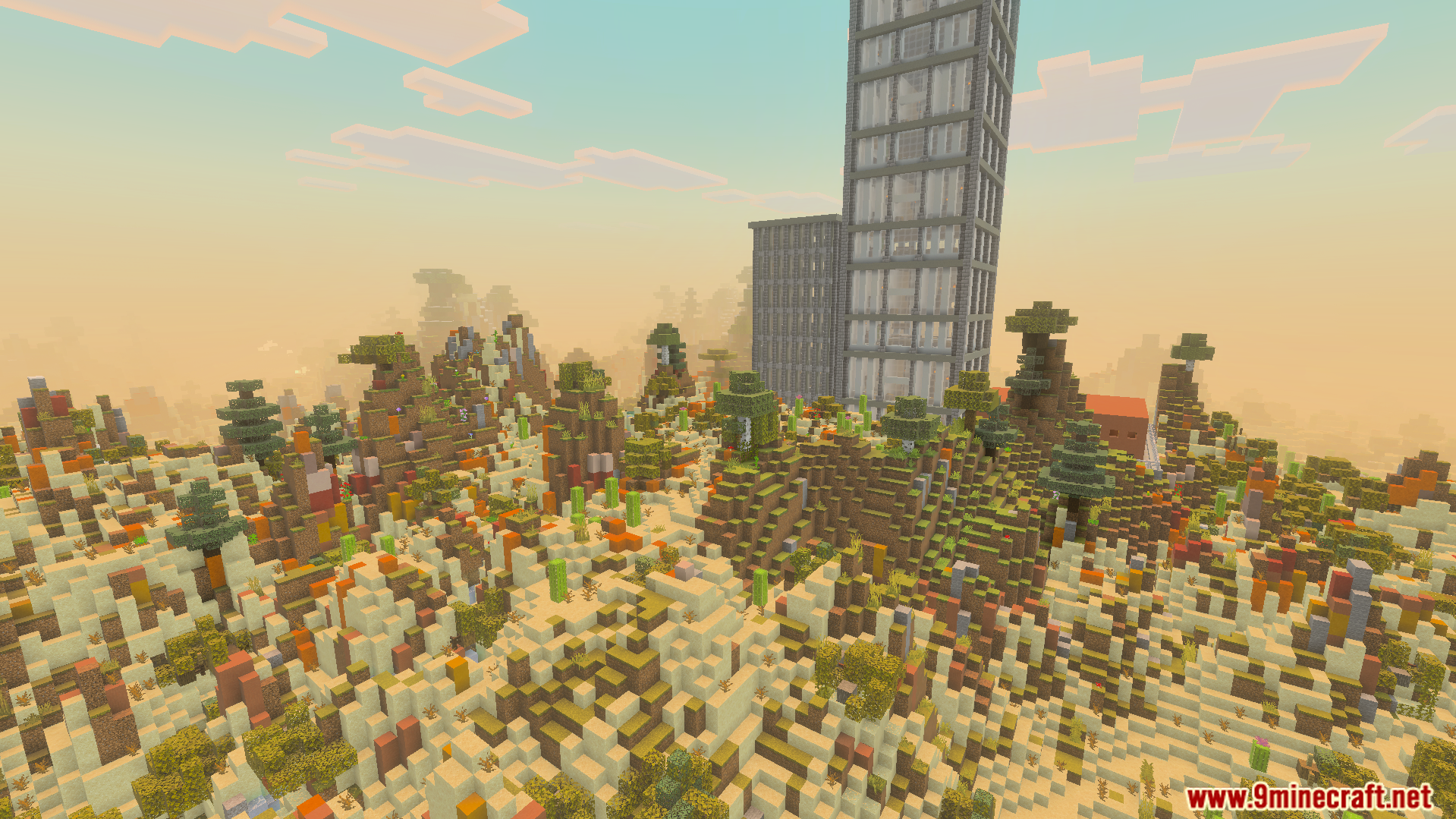 A tall grey building stands in a desert landscape