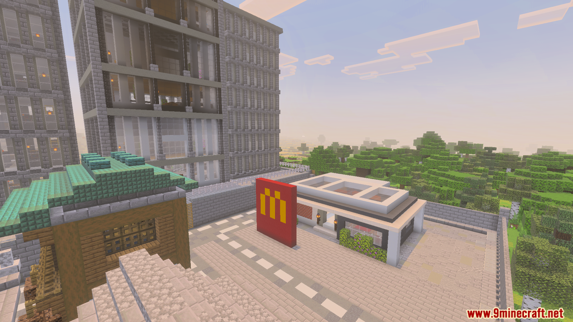 McDonalds restaurant next to tall grey building