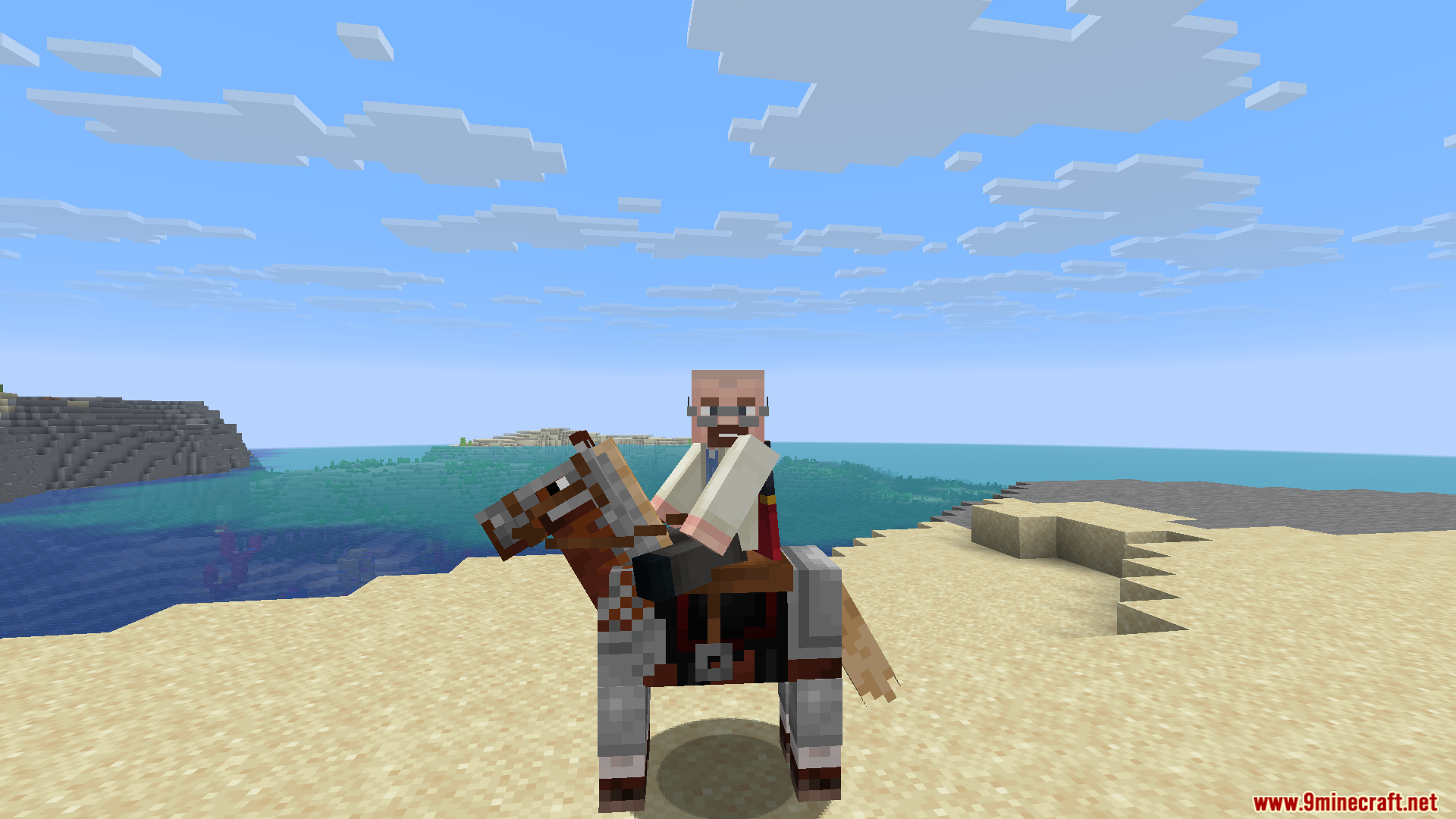 A bearded man riding a horse on a sandy beach