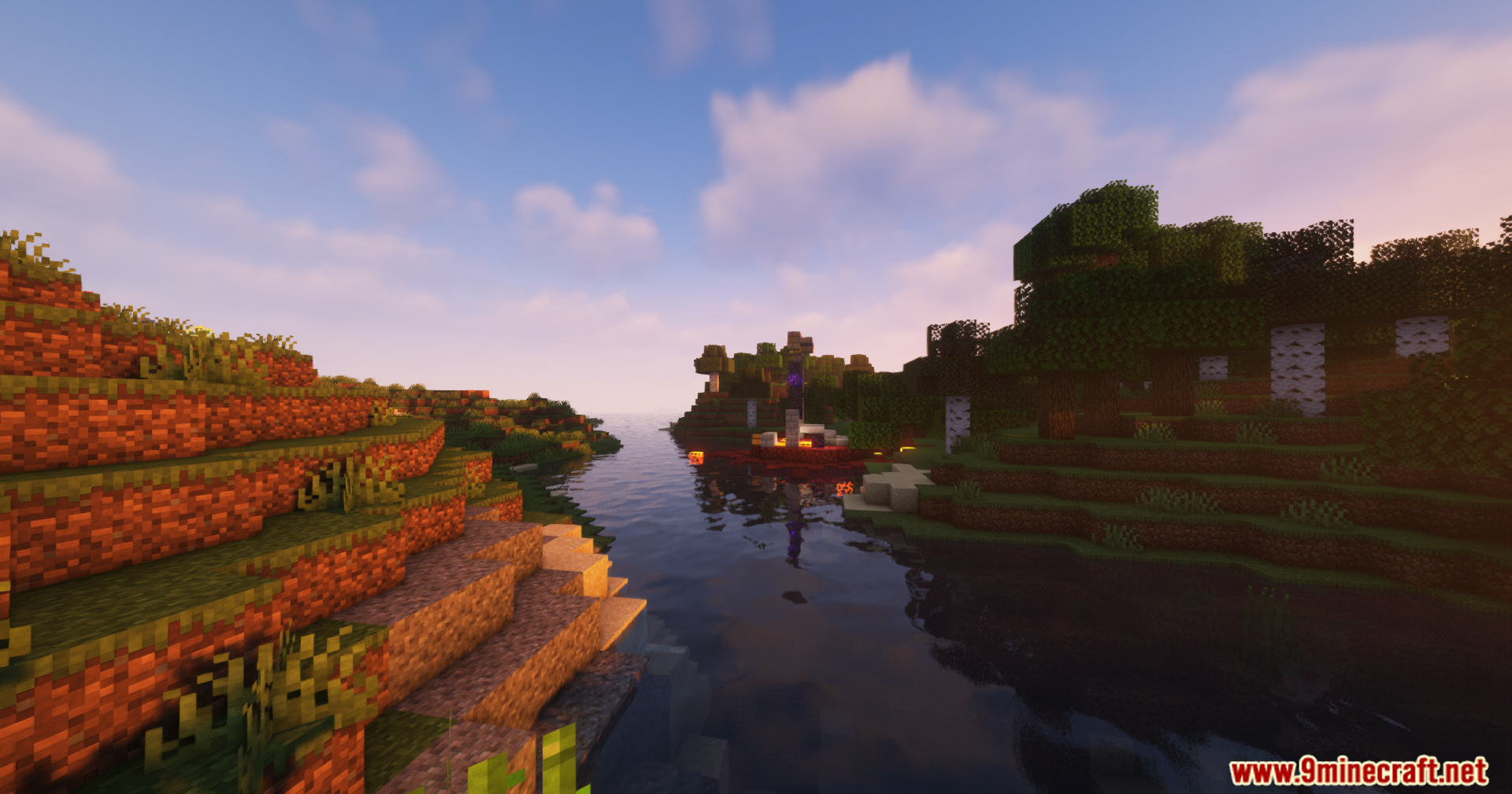 Minecraft river landscape with grassy hills and a ruined nether portal at sunset