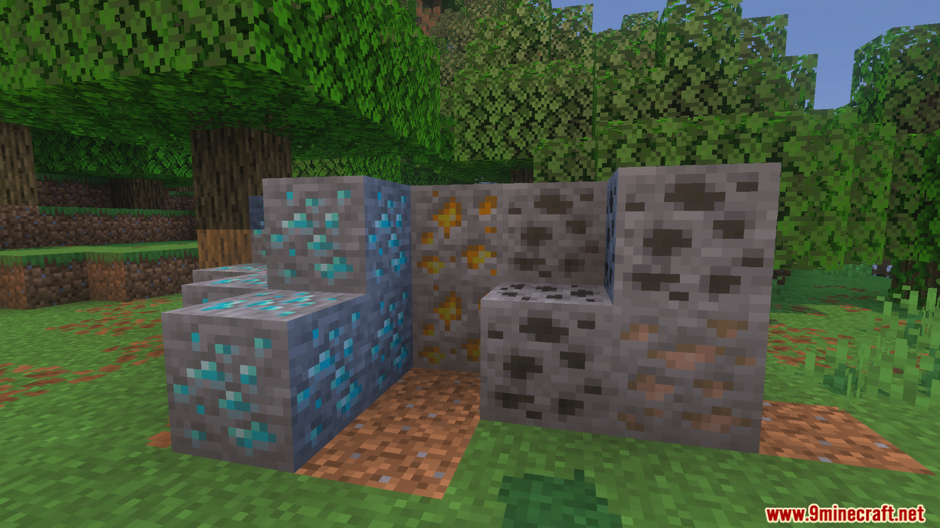 Various ore blocks placed together on the grass for mining