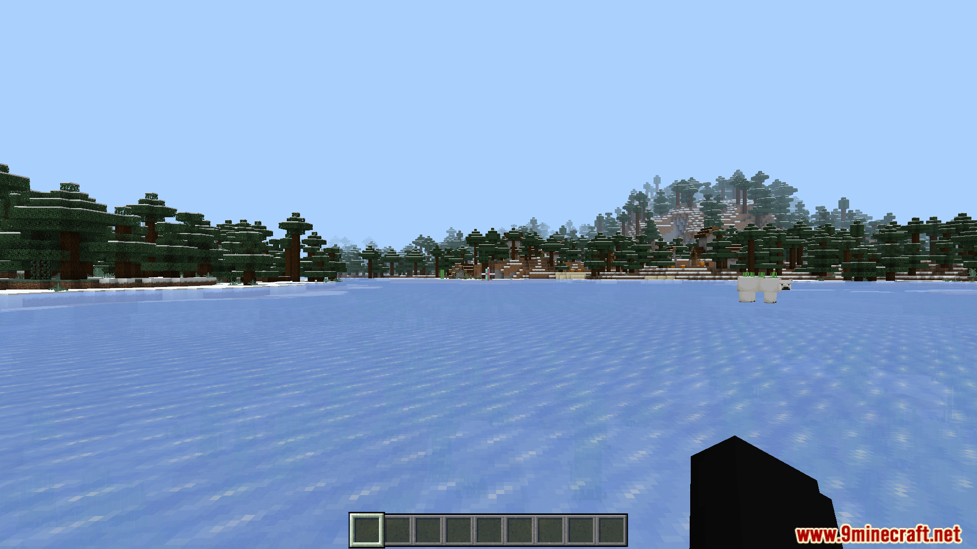 Just Zoom Addon Screenshot 4 A frozen lake surrounded by snowy trees in a winter biome